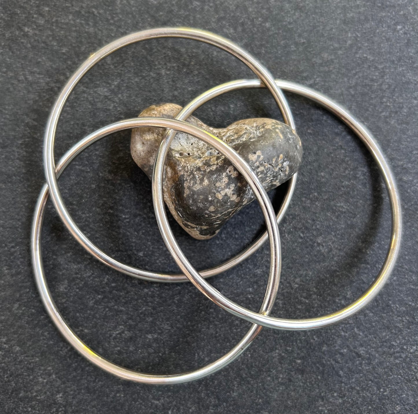 Vintage sterling silver three inter locking bangles.