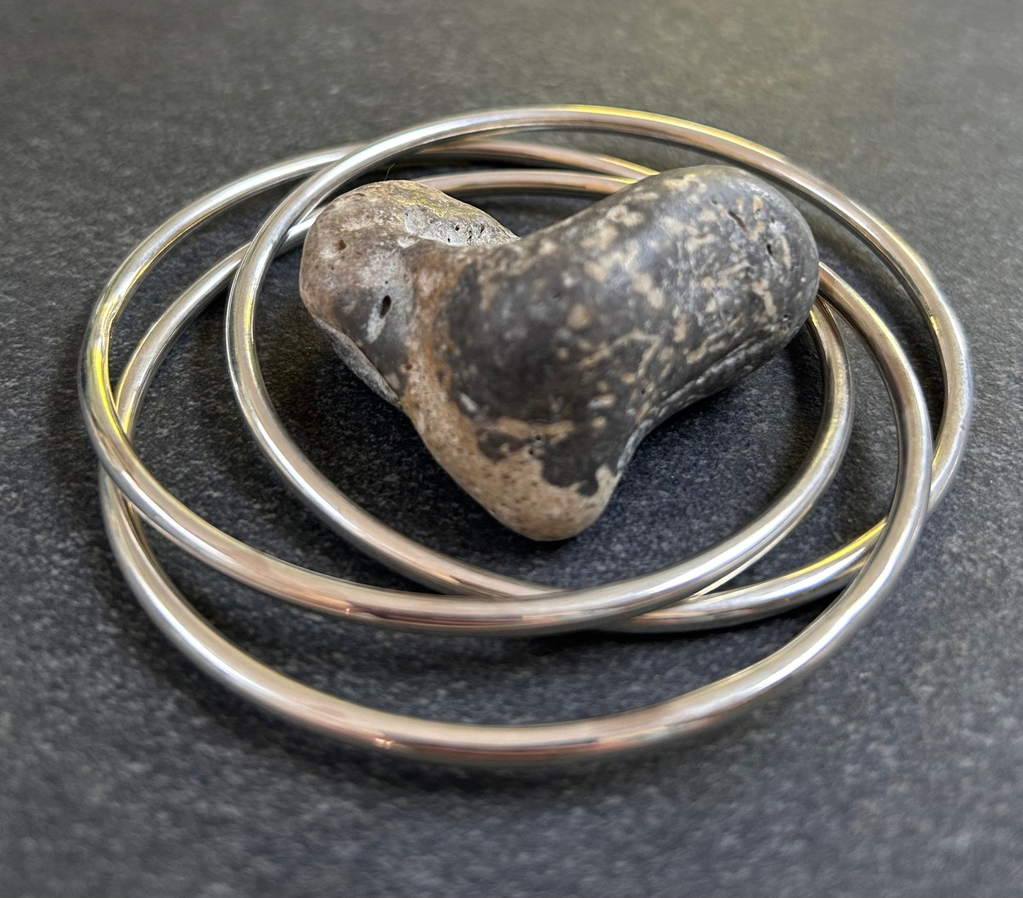Vintage sterling silver three inter locking bangles.