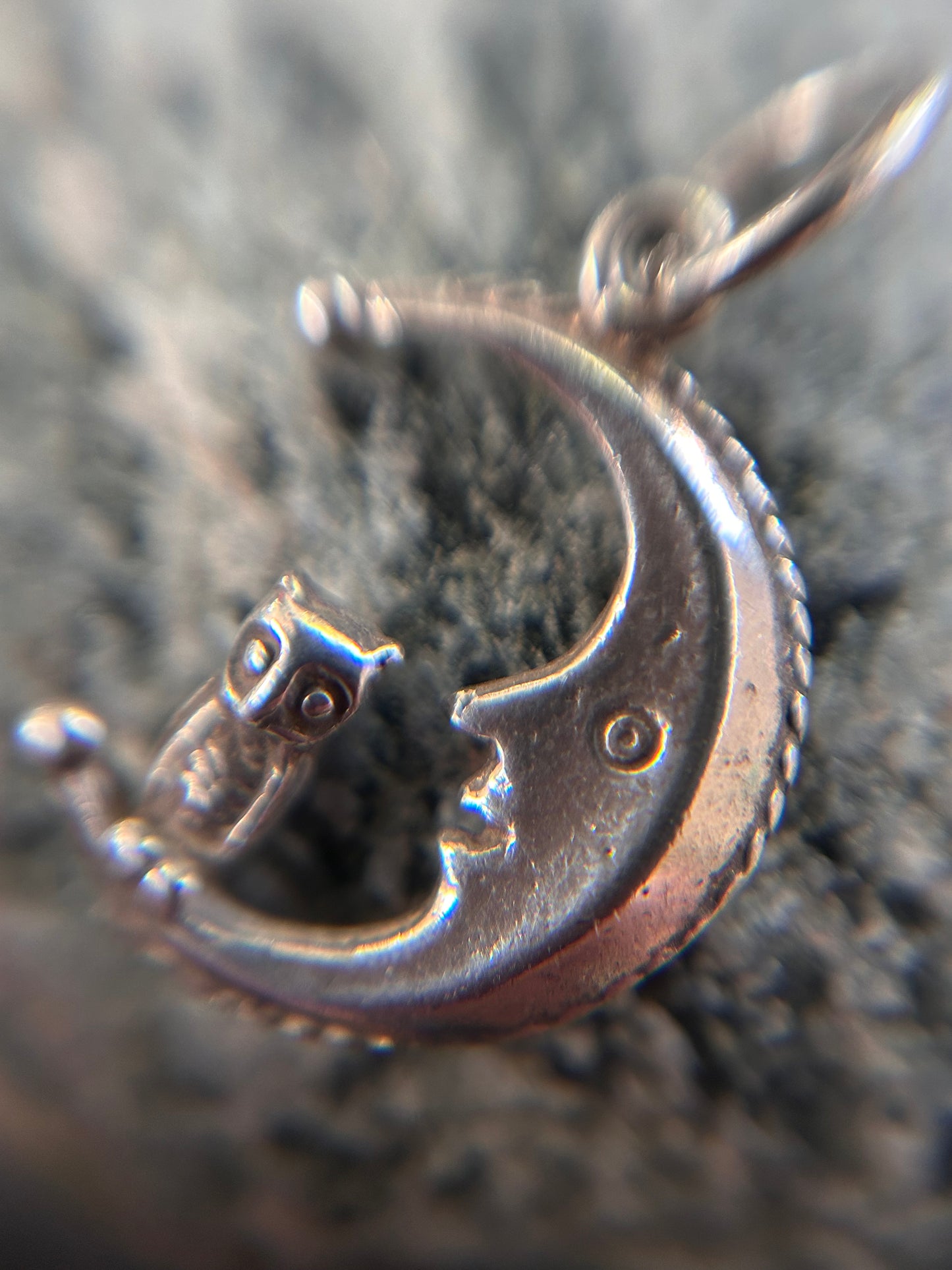 A beautifully whimsical vintage moon and owl pendant