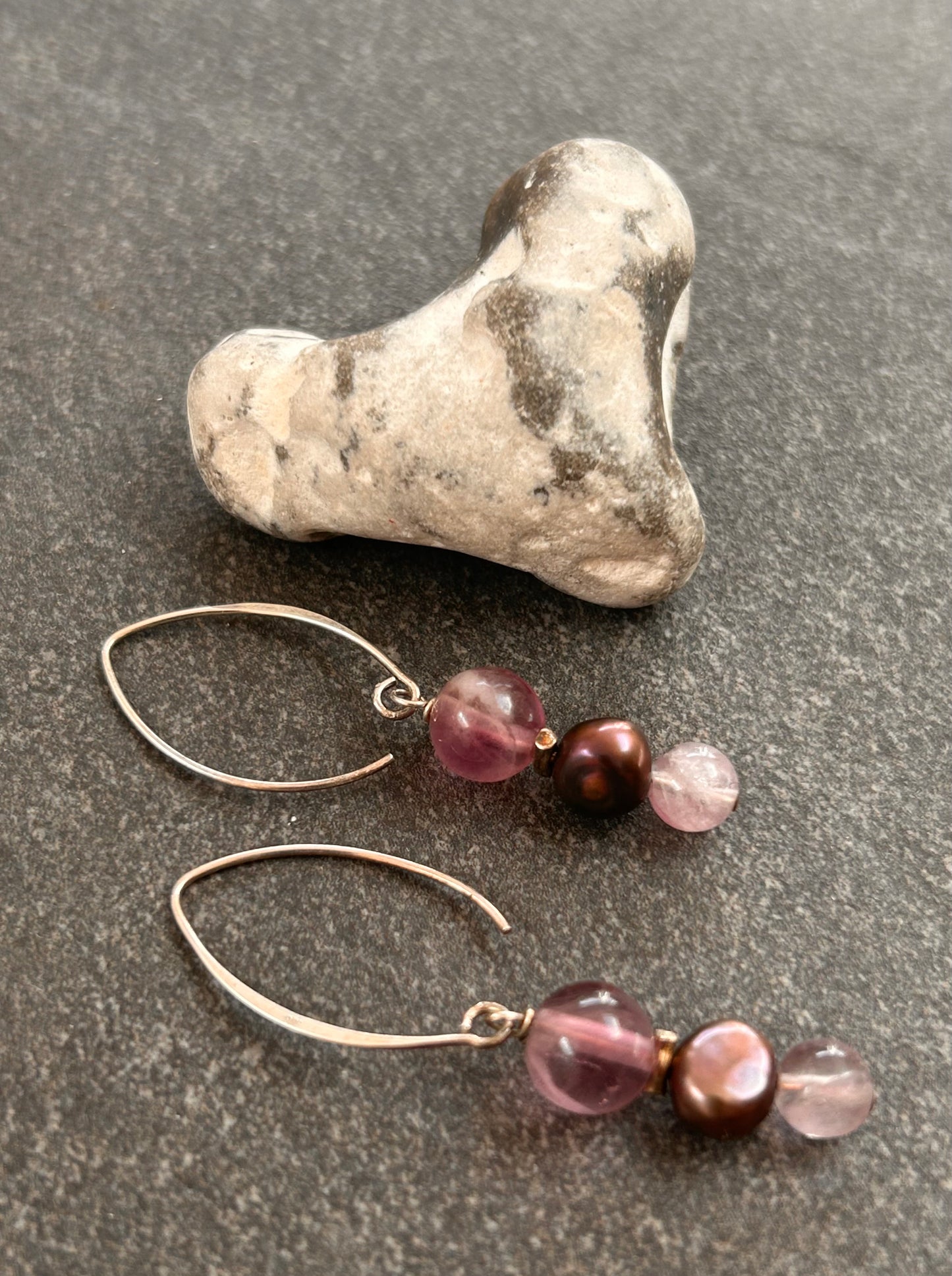 Simple and elegant, these sterling silver drop earrings feature rich amethyst beads