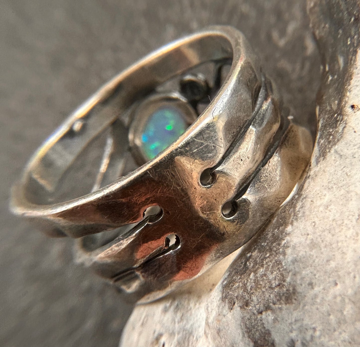 Vintage sterling silver artisan ring featuring a captivating lab-created opal