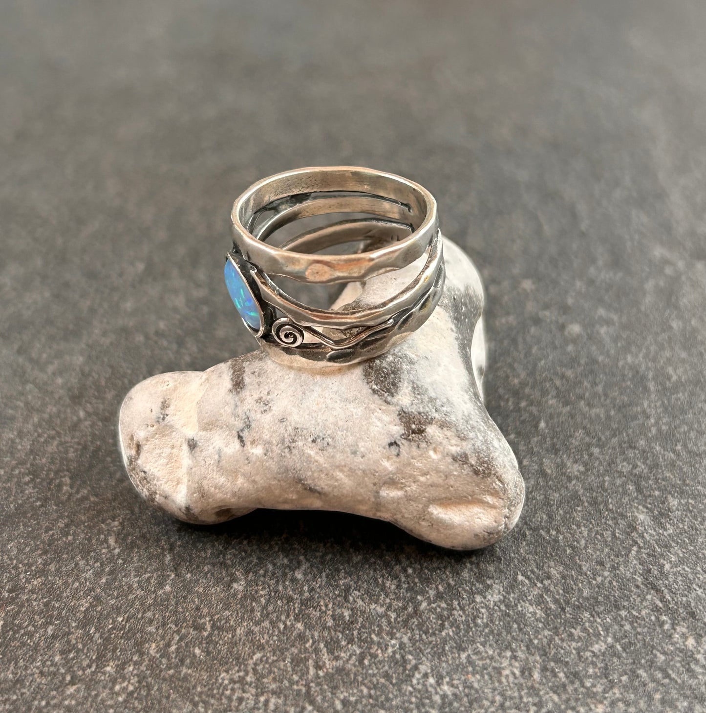 Vintage sterling silver artisan ring featuring a captivating lab-created opal