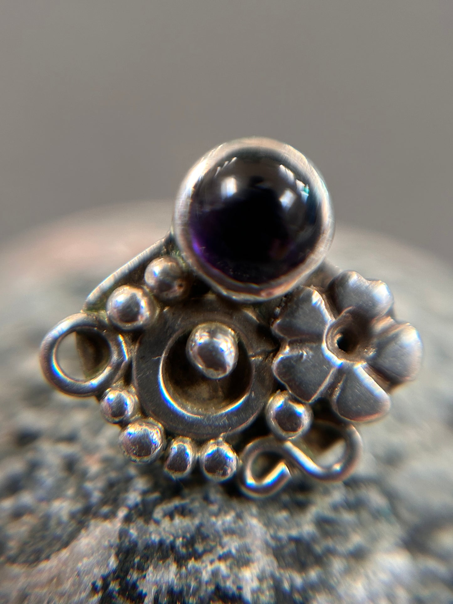 Beautiful sterling silver stud earrings set with cabochon-cut amethysts.