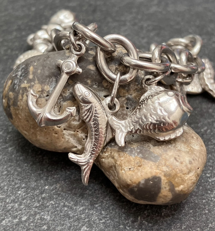 Absolutely stunning vintage sterling silver sea charm bracelet.