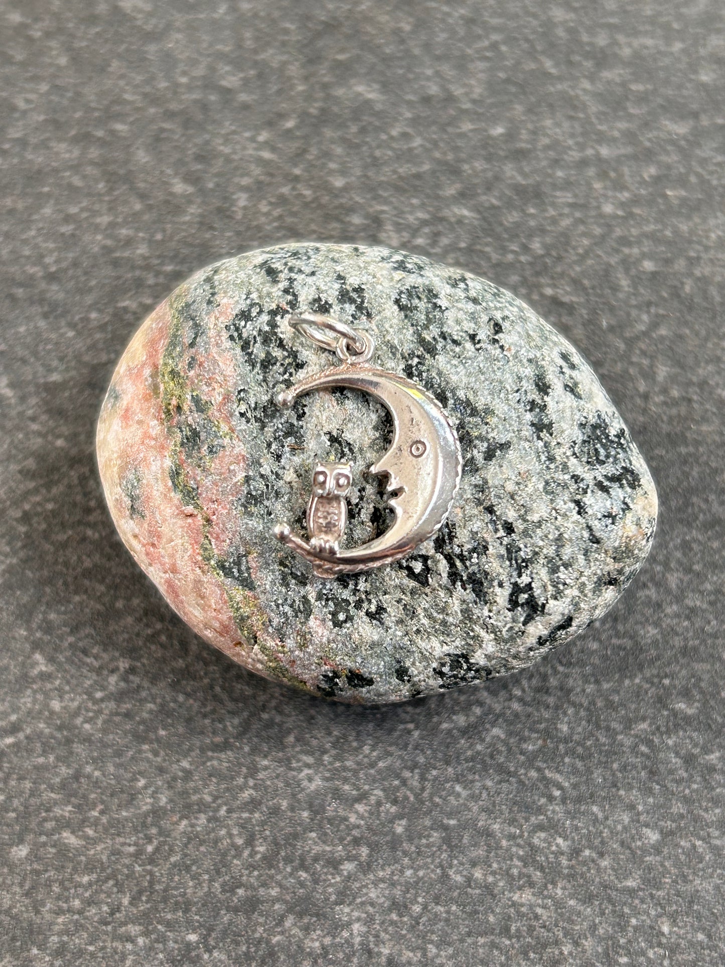 A beautifully whimsical vintage moon and owl pendant