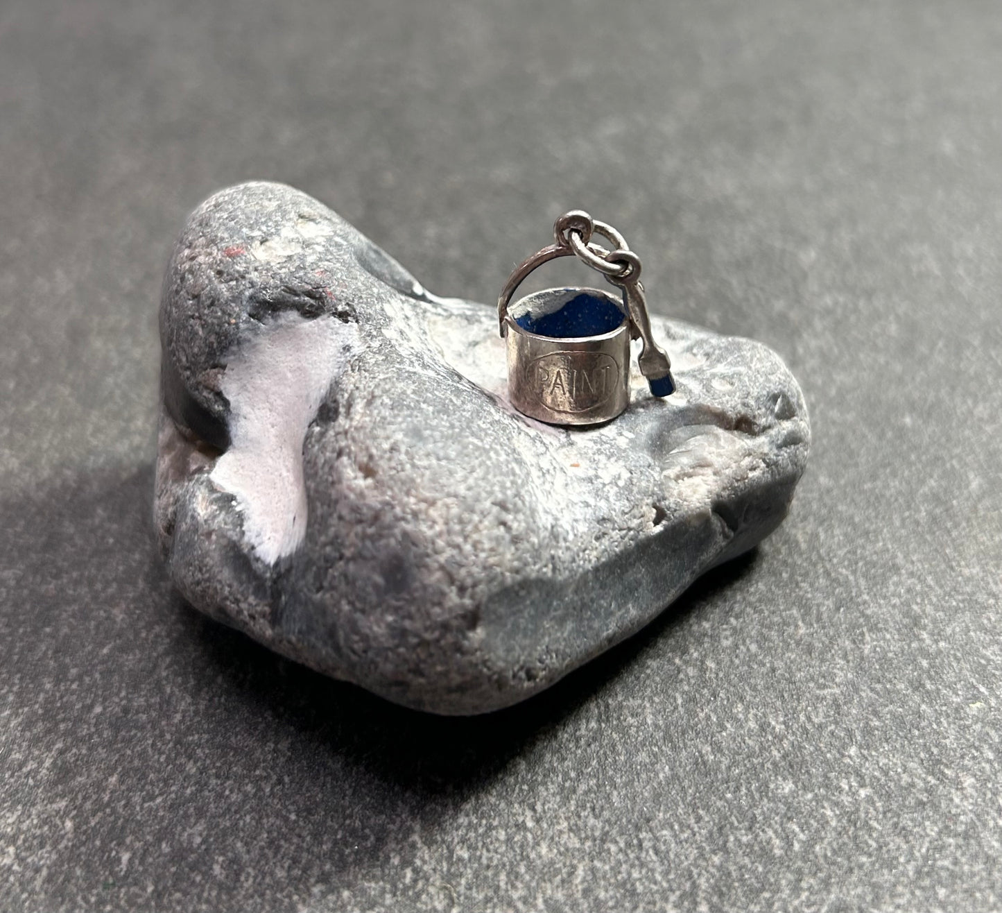 Pendant beautifully crafted in the shape of a painter’s paint pot and brush