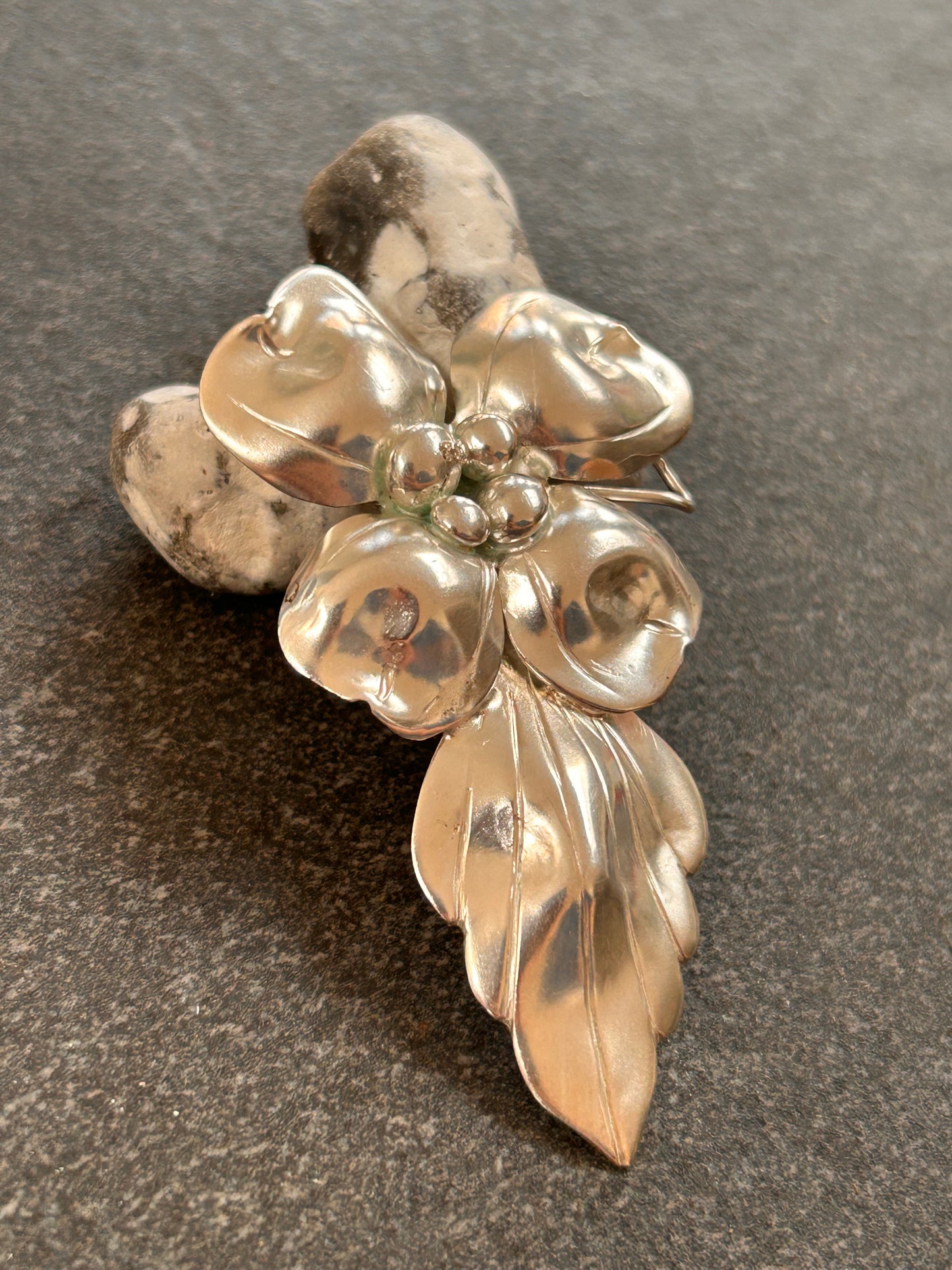 A rare sterling silver dogwood flower pendant from John Wanamaker.