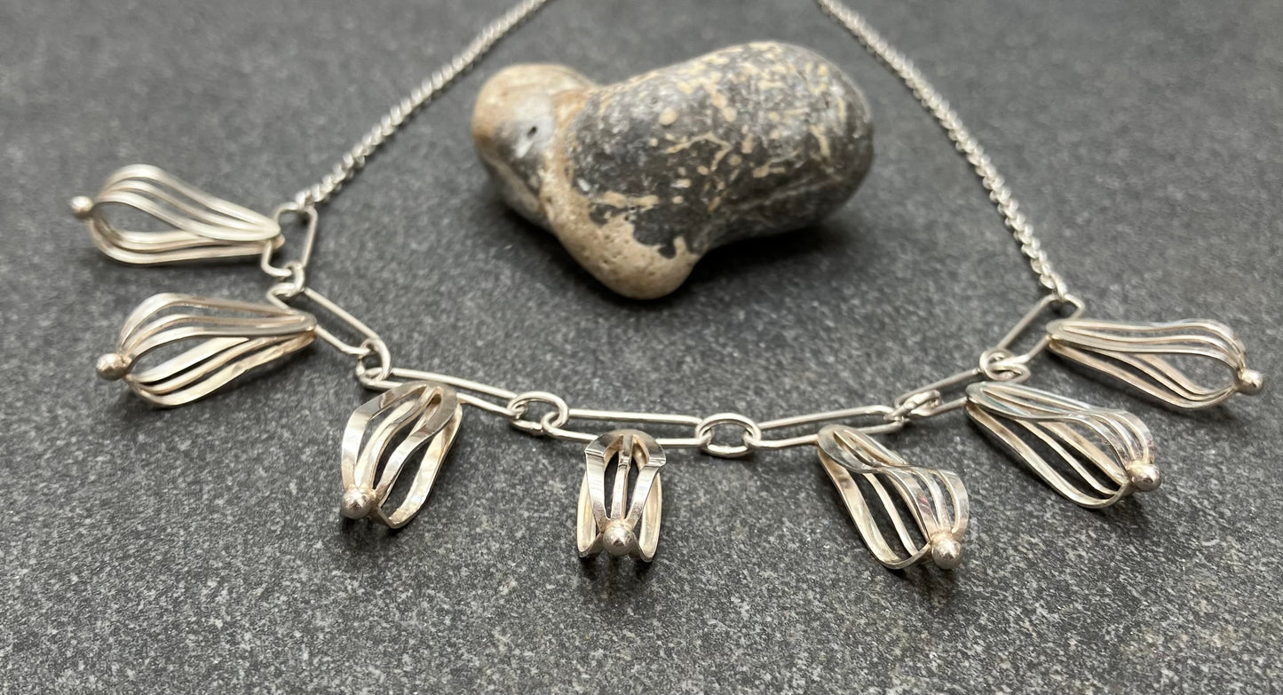 Artisan sterling silver sculptural necklace.