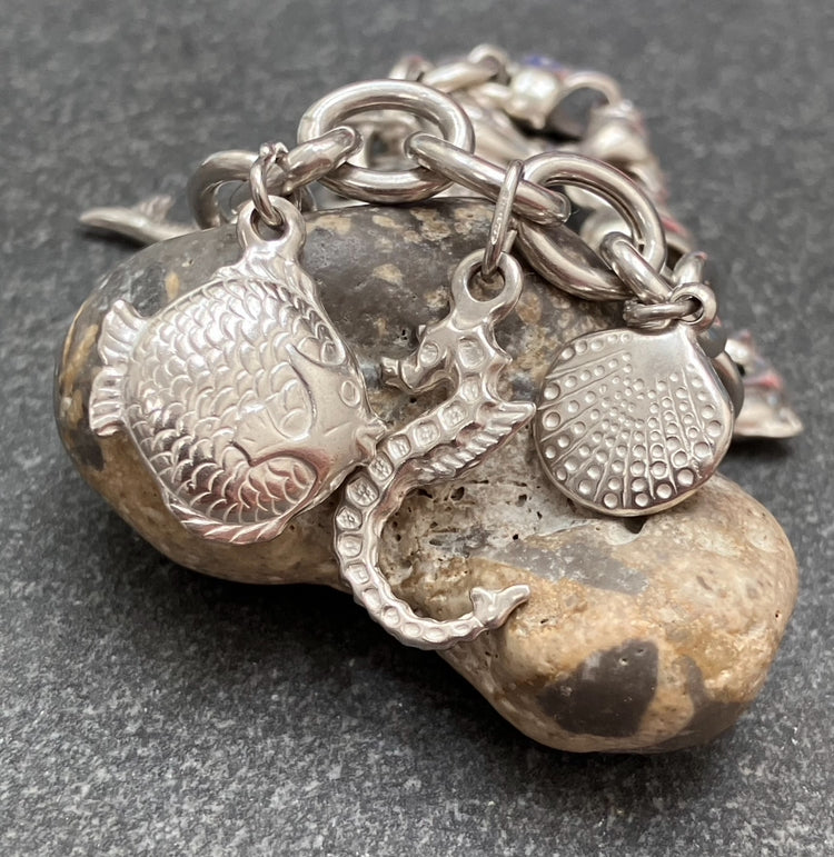 Absolutely stunning vintage sterling silver sea charm bracelet.