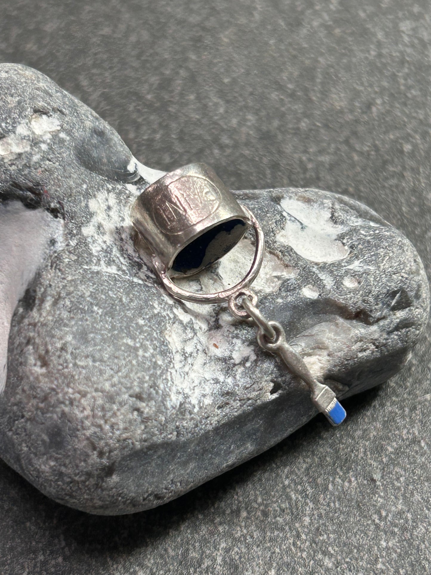 Pendant beautifully crafted in the shape of a painter’s paint pot and brush