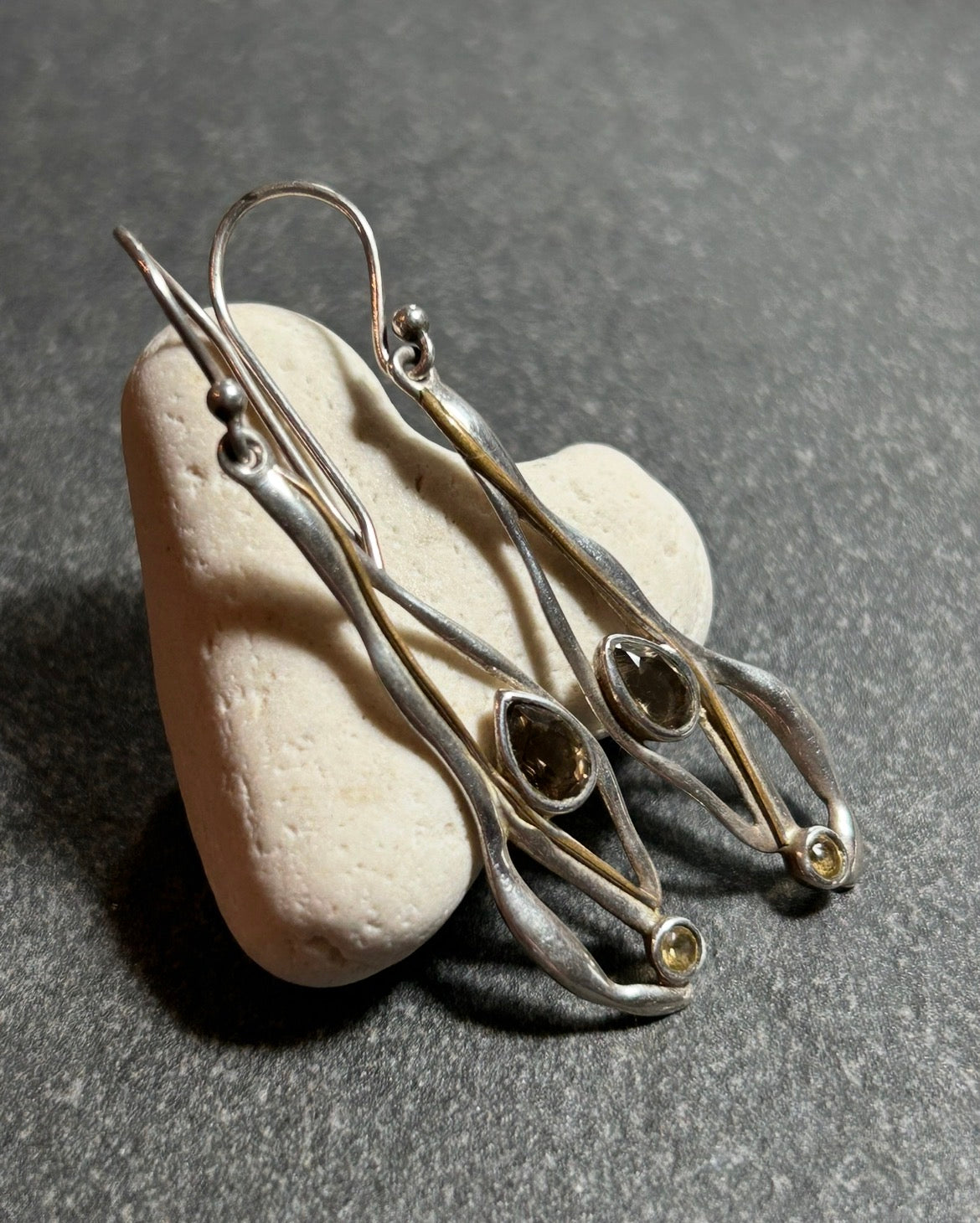 Vintage sterling silver artisan earrings with a graceful organic form.