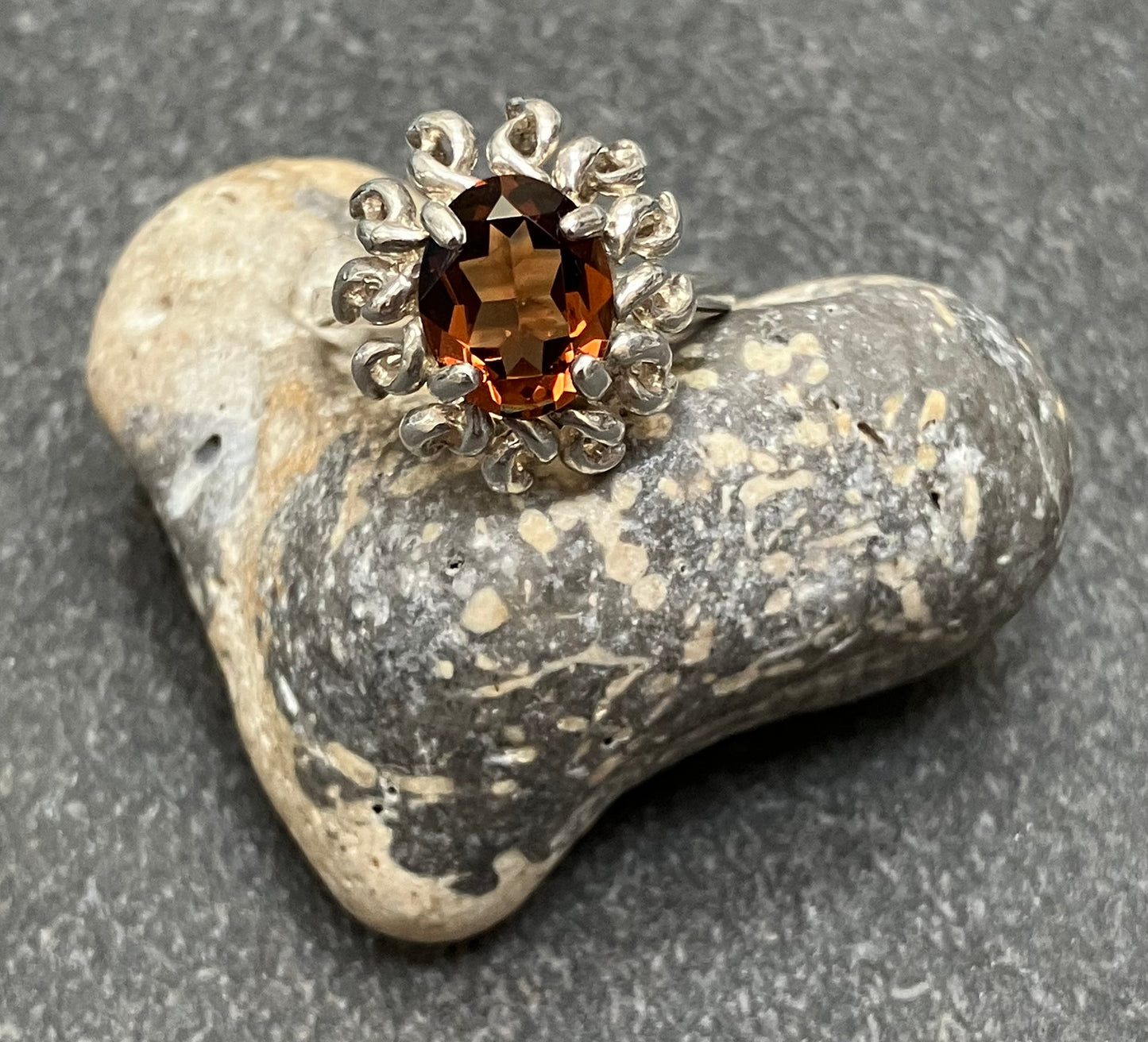 Vintage sterling silver ring set with a mandarin garnet cut stone