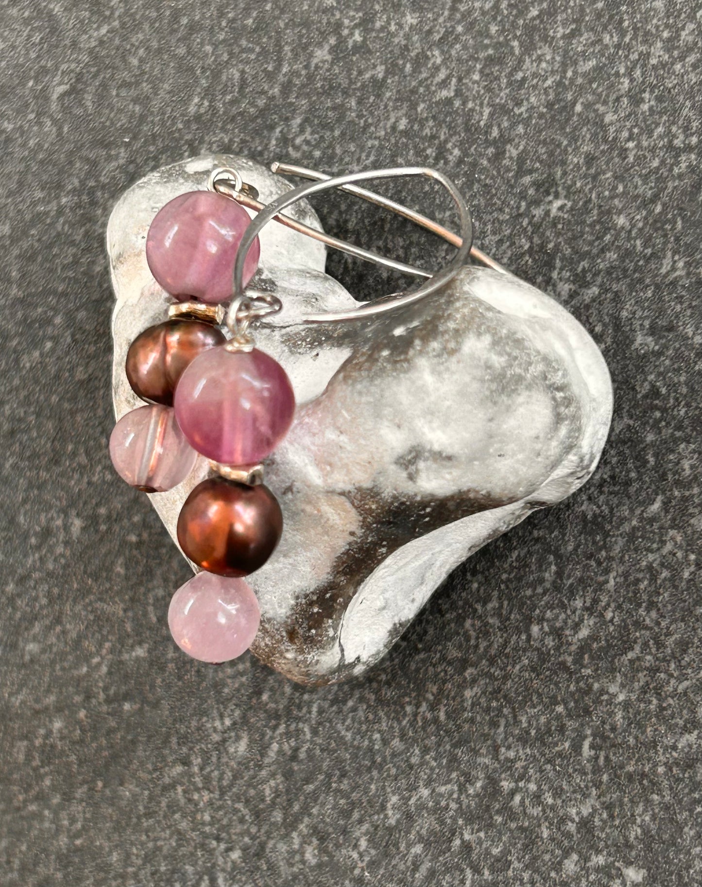 Simple and elegant, these sterling silver drop earrings feature rich amethyst beads