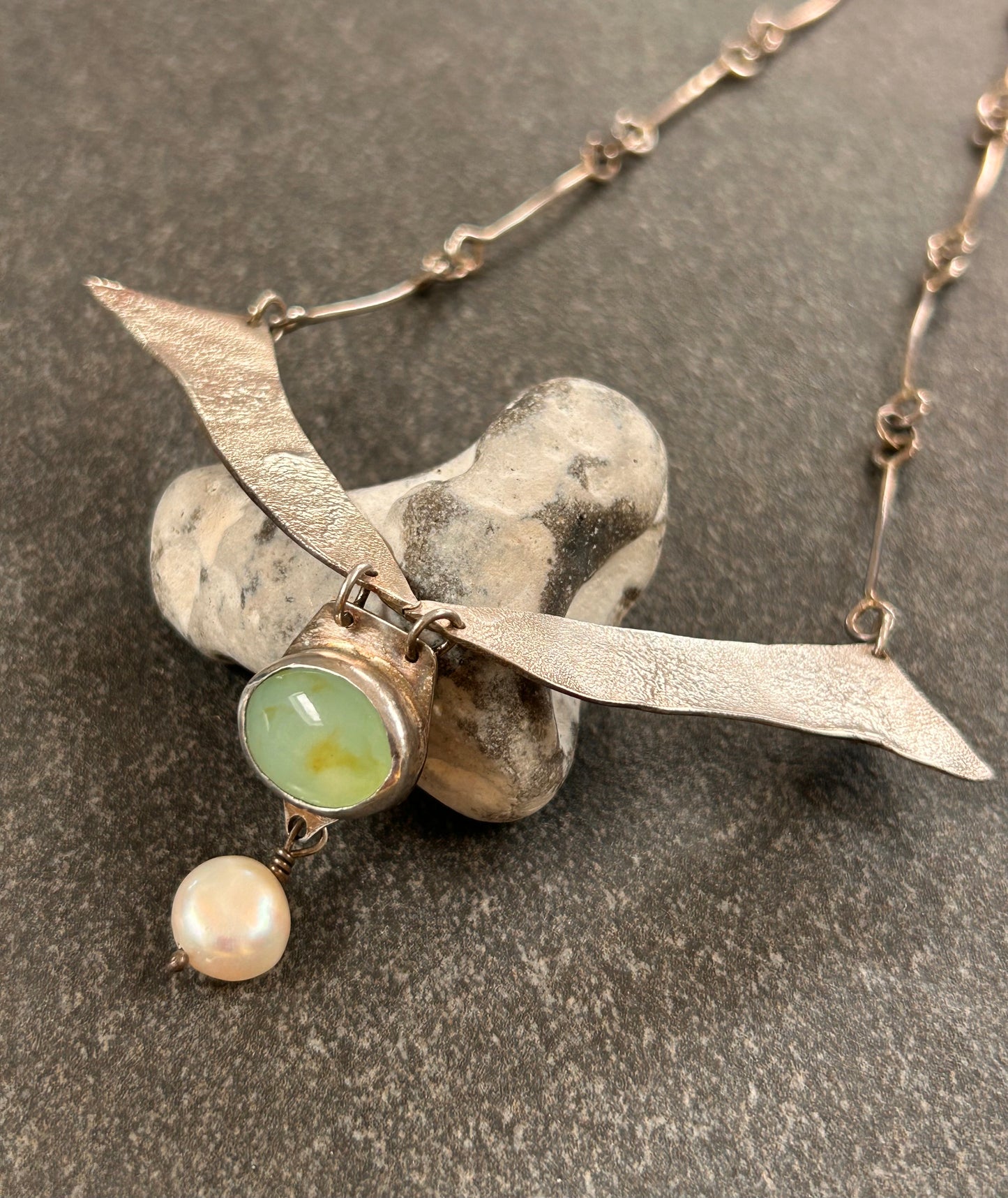 A beautifully handcrafted artisan necklace inspired by the delicate form of sycamore seeds.
