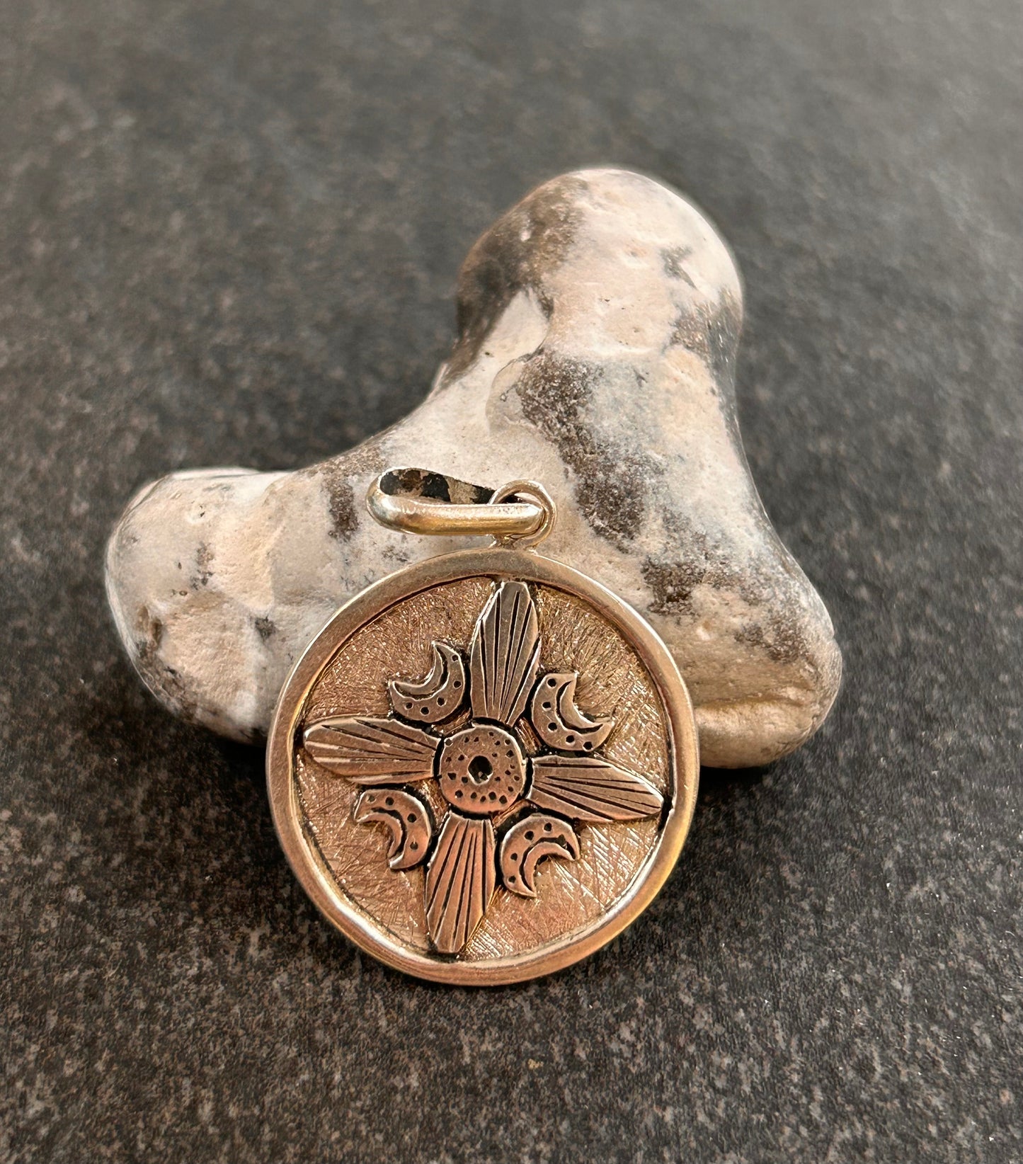 A striking vintage sterling silver circular pendant