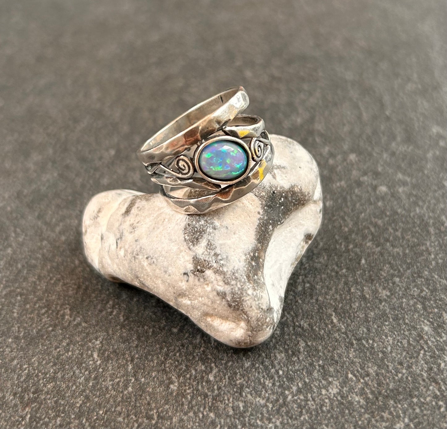 Vintage sterling silver artisan ring featuring a captivating lab-created opal