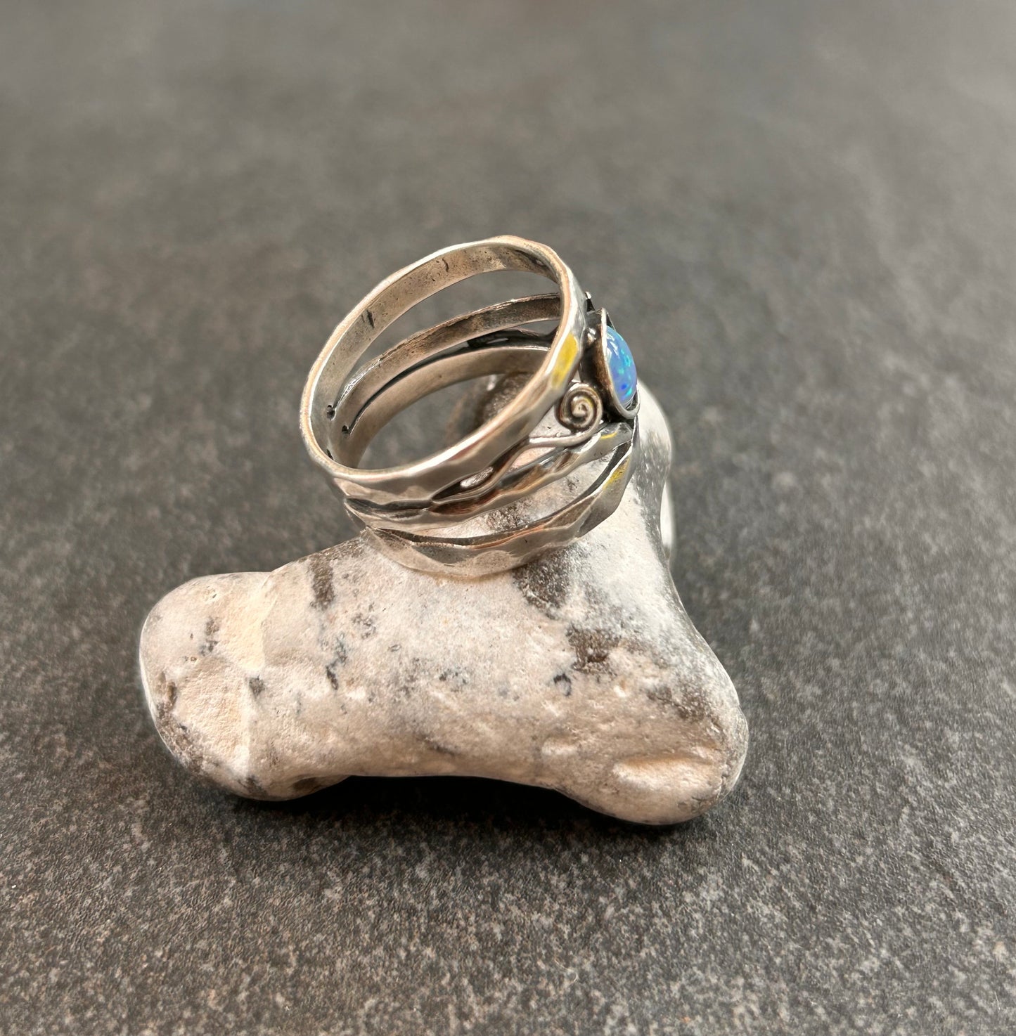 Vintage sterling silver artisan ring featuring a captivating lab-created opal