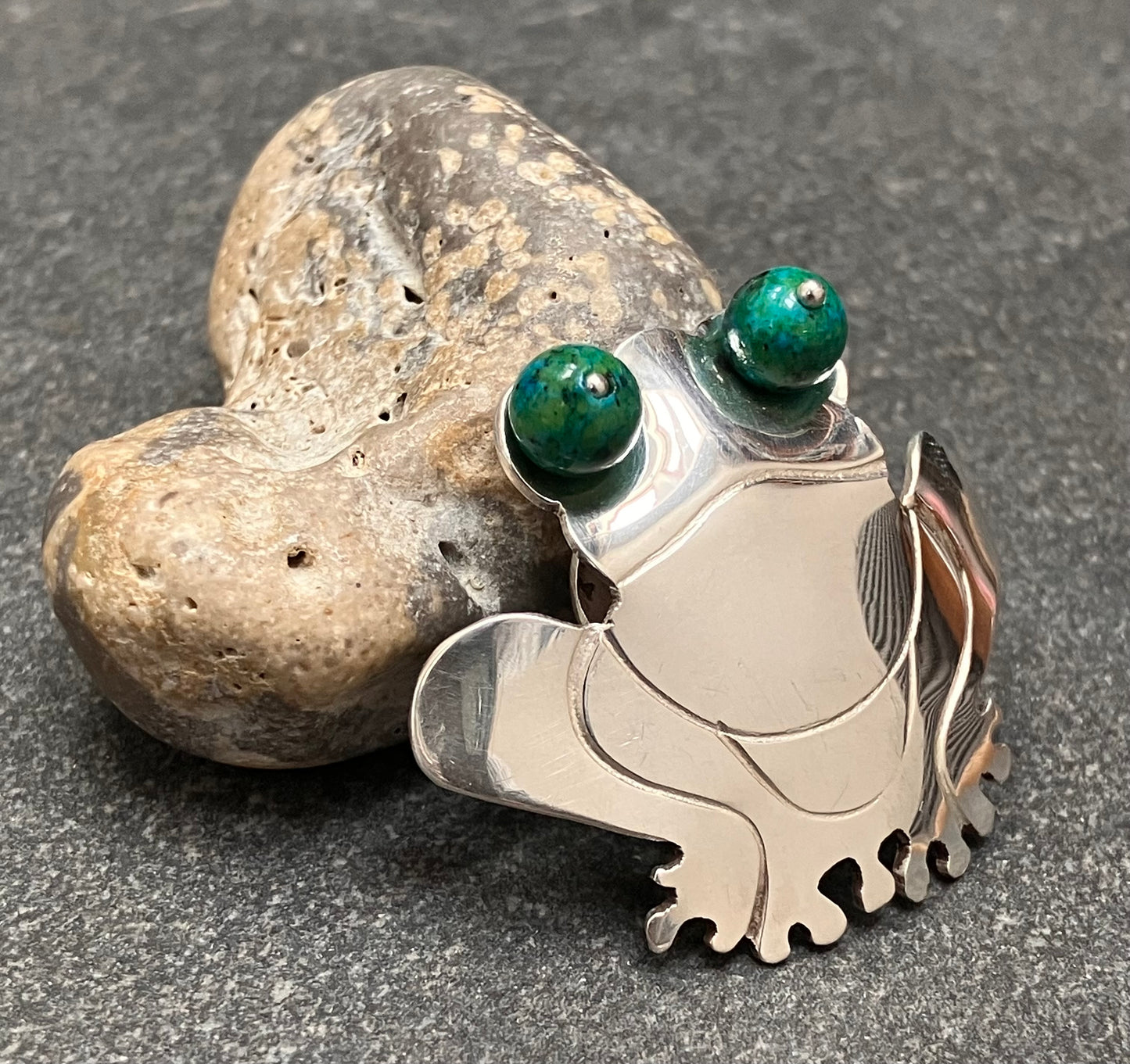 Vintage sterling silver frog pendant with chrysocolla stone sphere eyes.