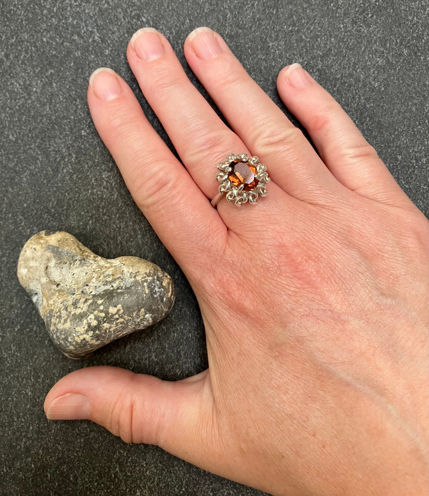 Vintage sterling silver ring set with a mandarin garnet cut stone