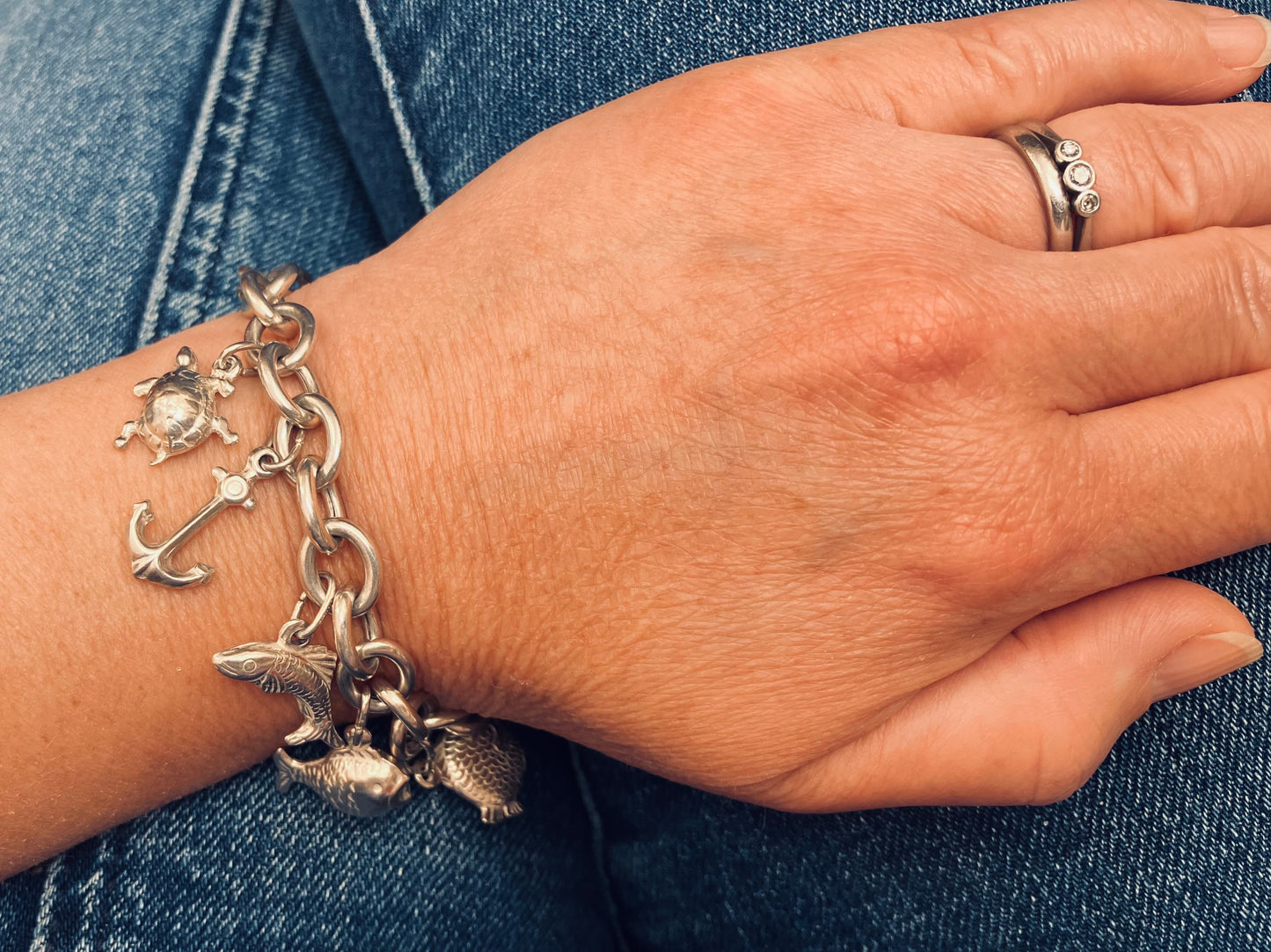 Absolutely stunning vintage sterling silver sea charm bracelet.