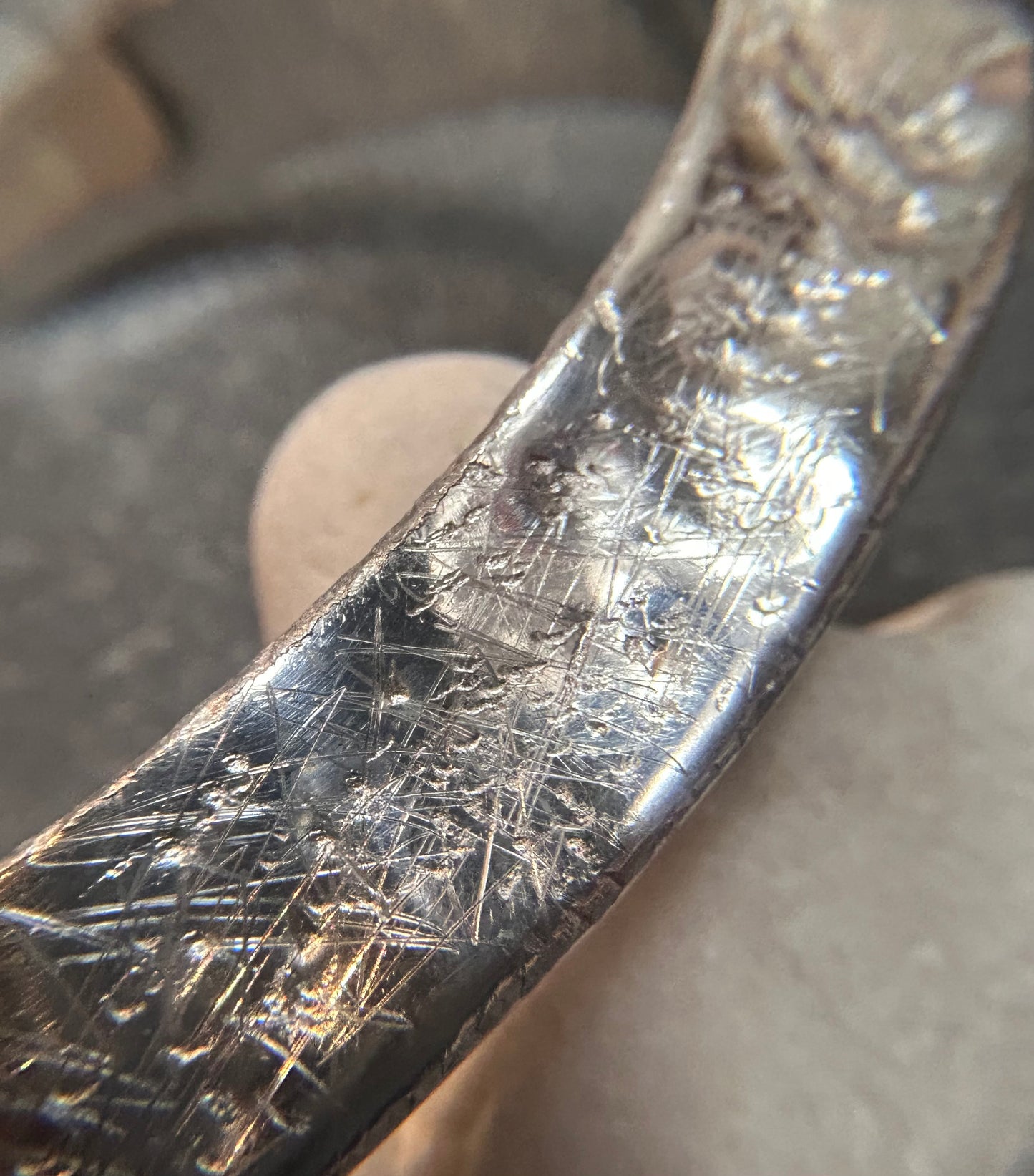 This vintage sterling silver artisan bangle is a one-off piece, alive with texture and character.