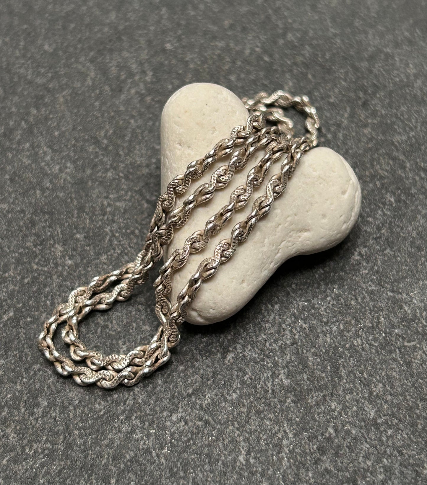 Beautiful vintage sterling silver necklace features elegant infinity links