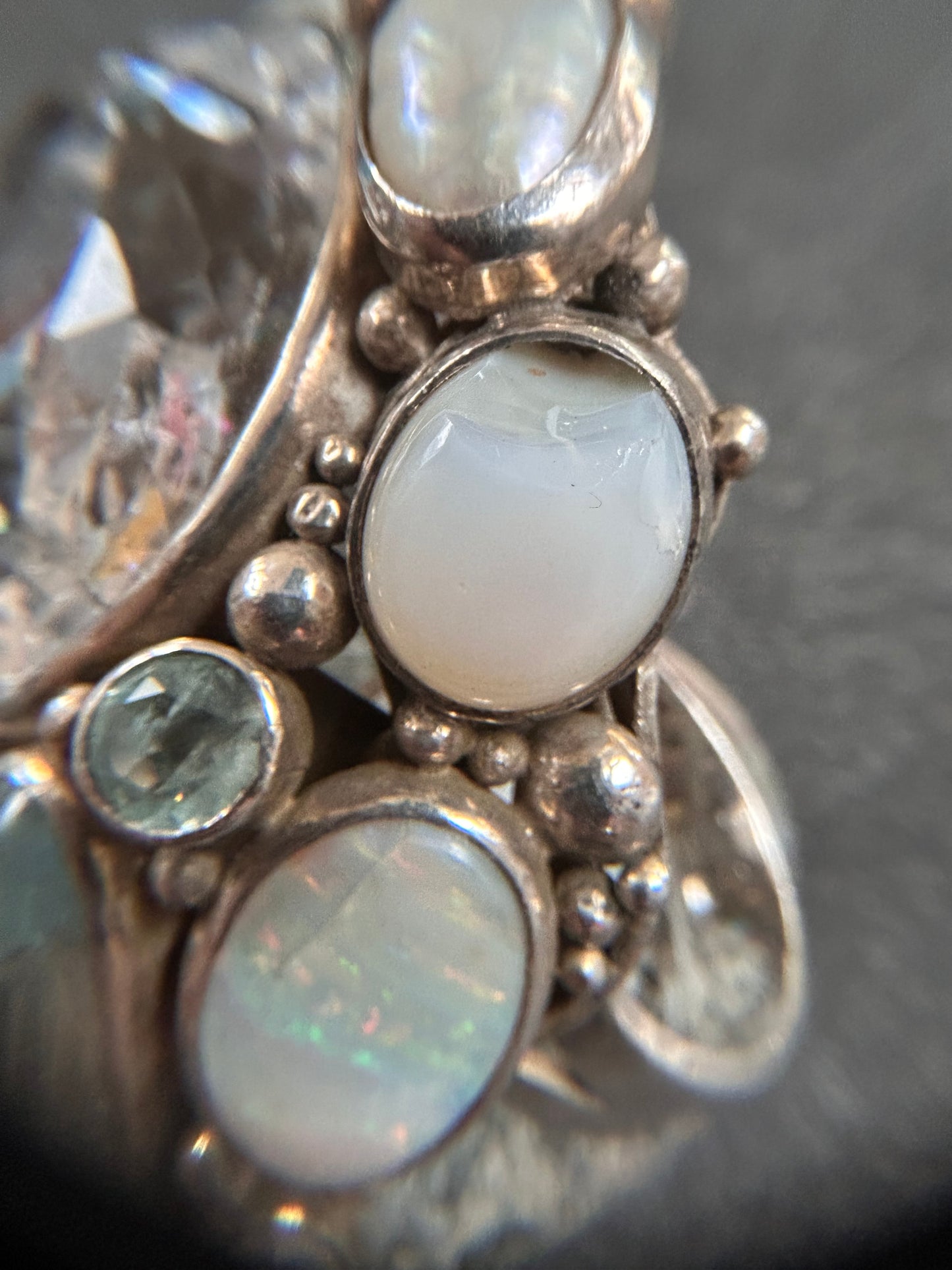 Spectacular Polish Artisan Double-Finger Ring.
Sterling Silver, Rock Crystal, Topaz, Opals, Aquamarine & Pearls.