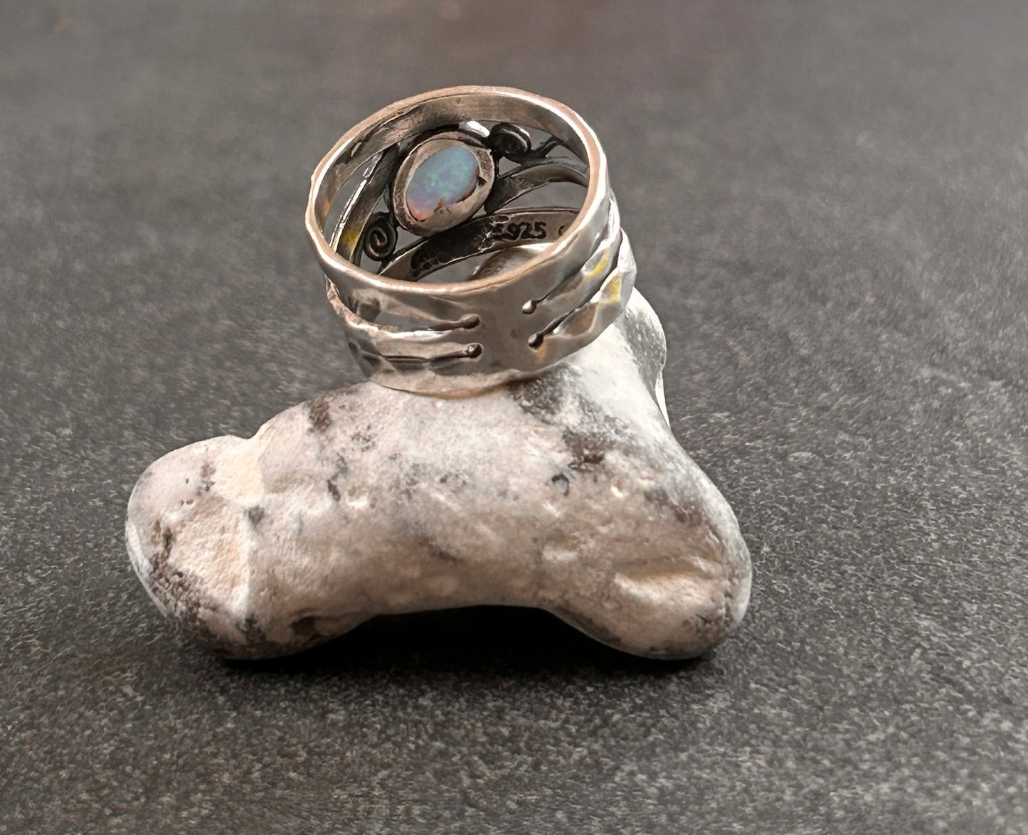 Vintage sterling silver artisan ring featuring a captivating lab-created opal