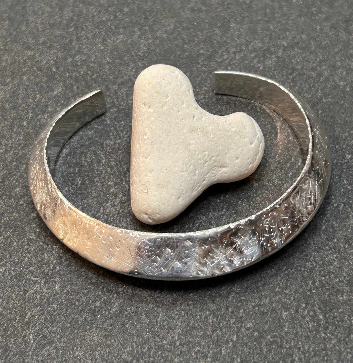 This vintage sterling silver artisan bangle is a one-off piece, alive with texture and character.