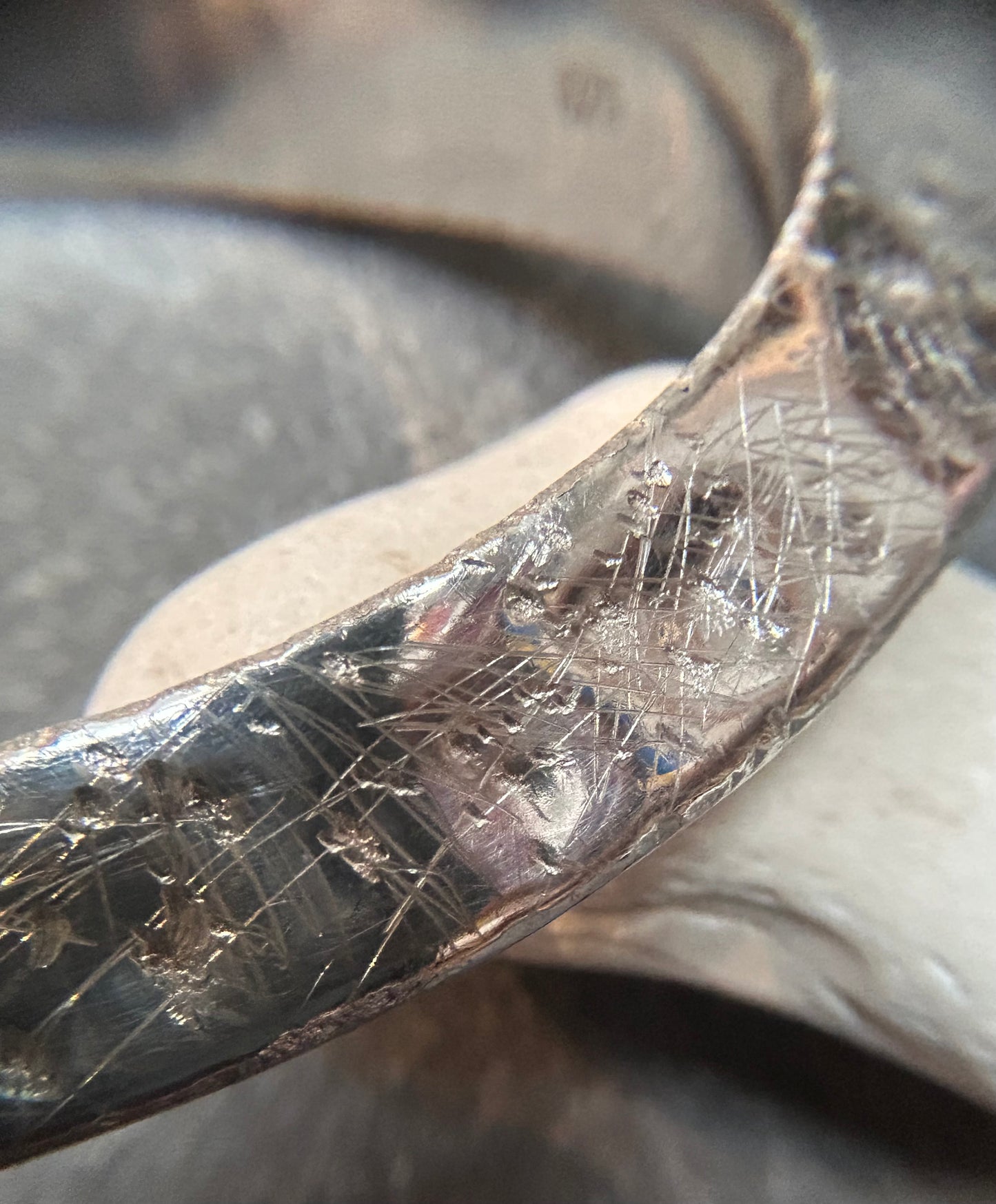 This vintage sterling silver artisan bangle is a one-off piece, alive with texture and character.