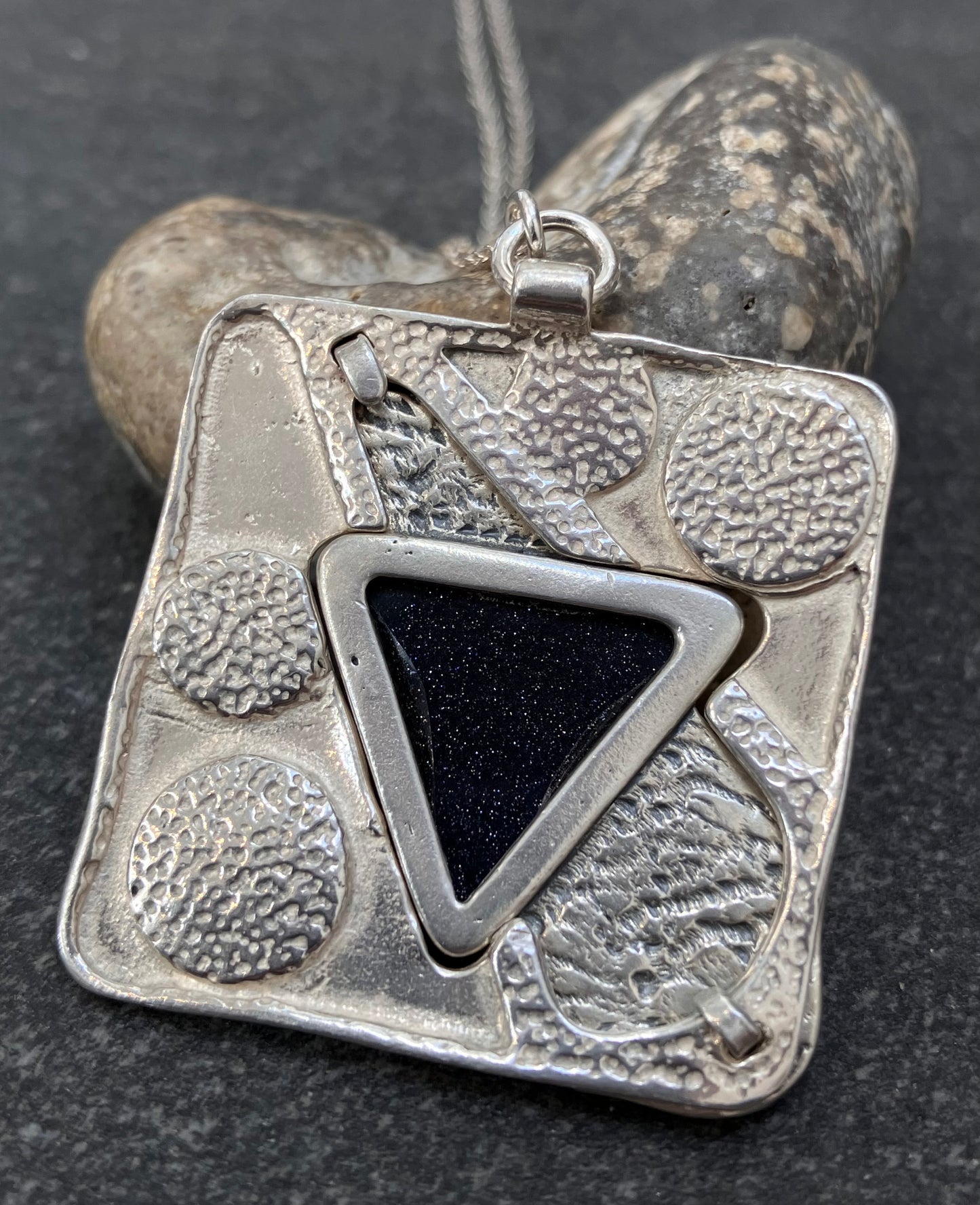 Vintage sterling silver pendant set with Blue goldstone.