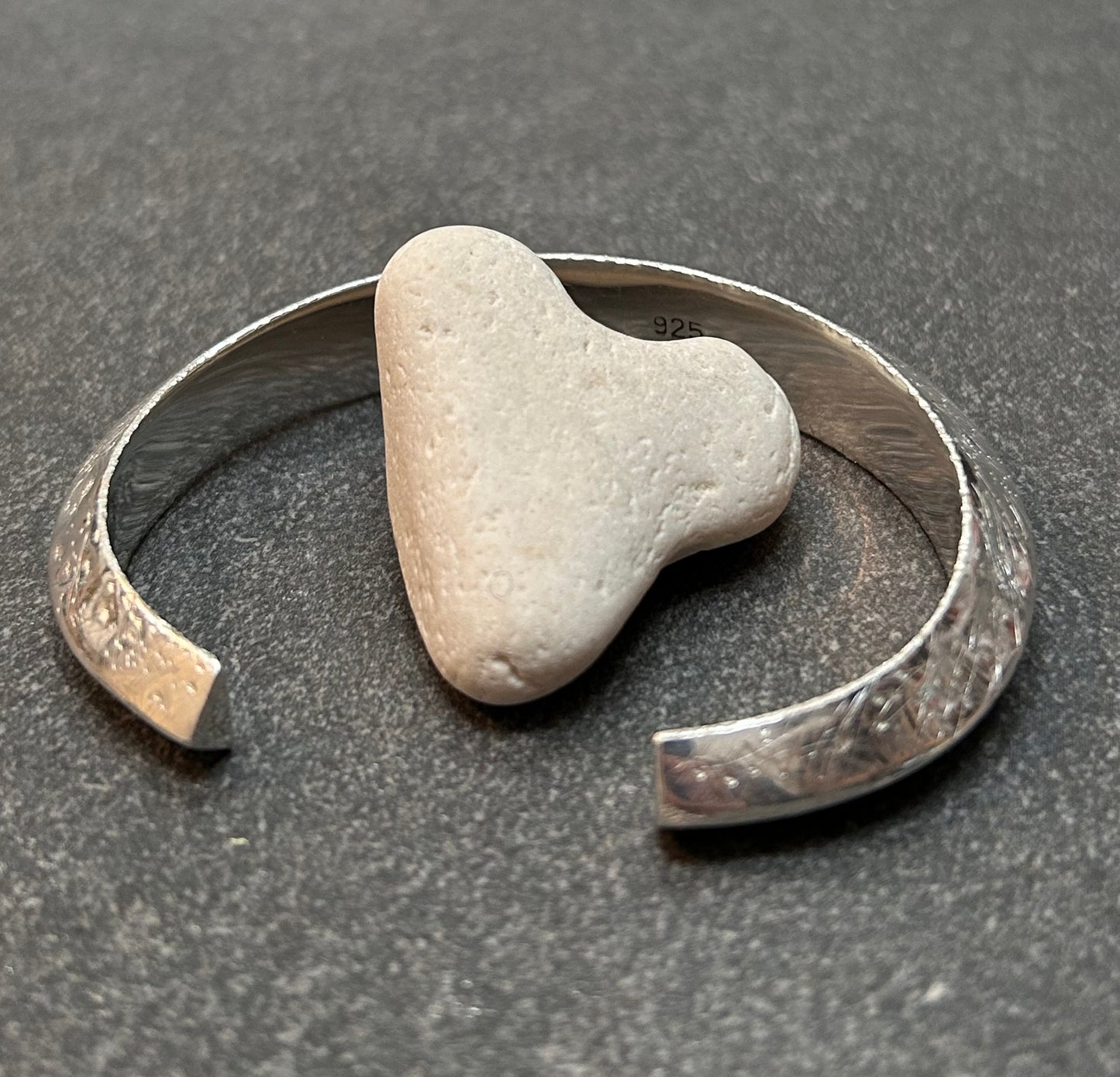 This vintage sterling silver artisan bangle is a one-off piece, alive with texture and character.