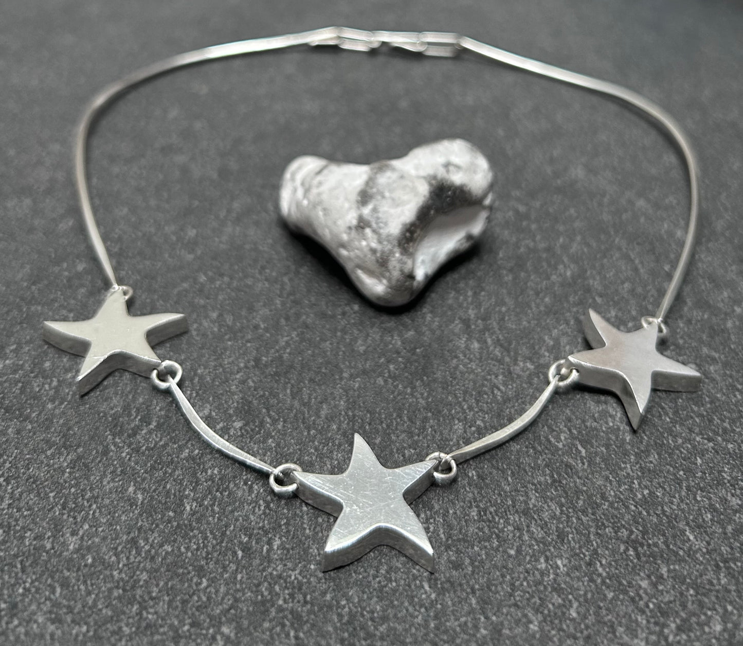 Wonderfully sculptural vintage sterling silver star necklace