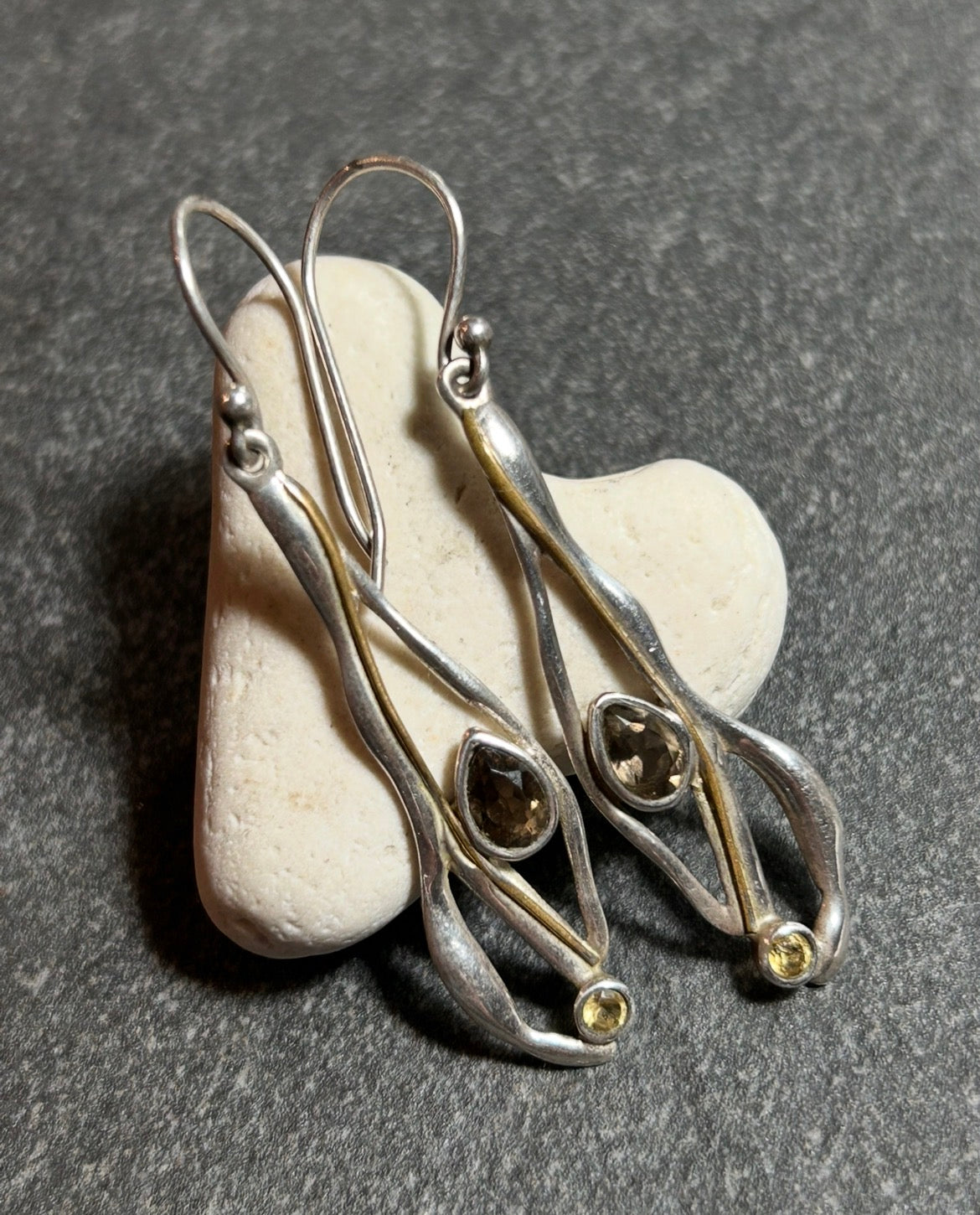 Vintage sterling silver artisan earrings with a graceful organic form.