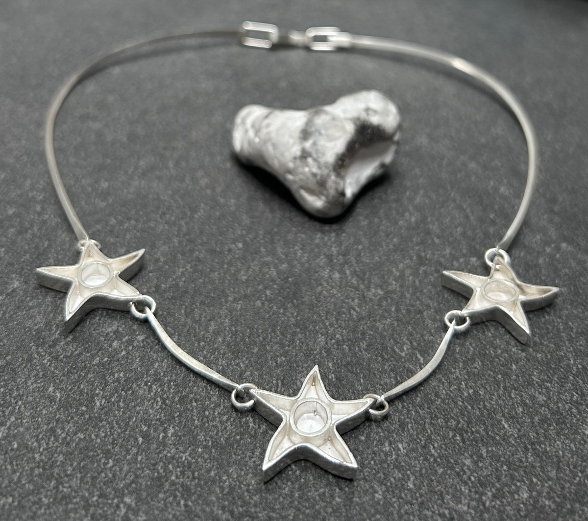 Wonderfully sculptural vintage sterling silver star necklace