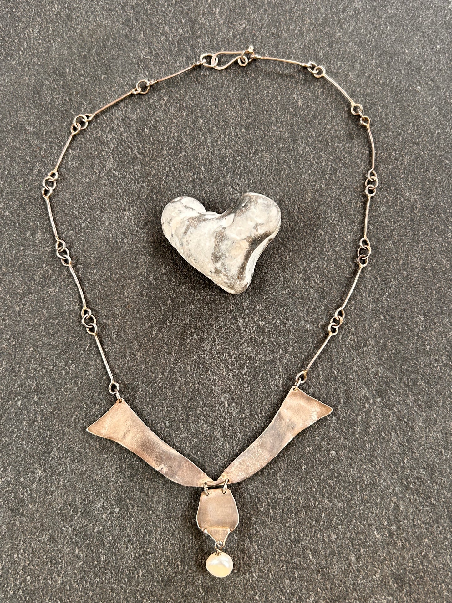 A beautifully handcrafted artisan necklace inspired by the delicate form of sycamore seeds.