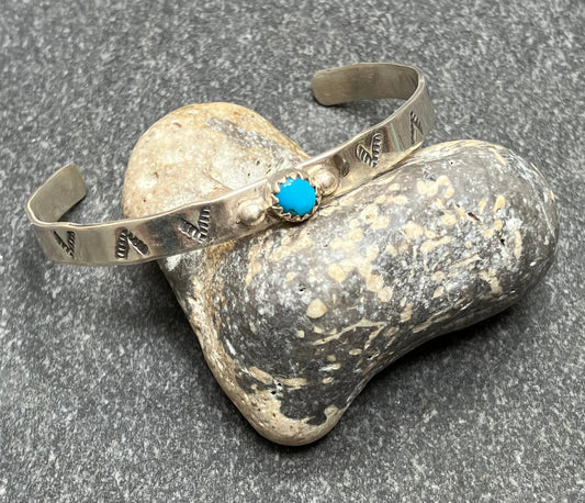 Vintage sterling silver Zuni artisan Childs sterling silver bracelet.