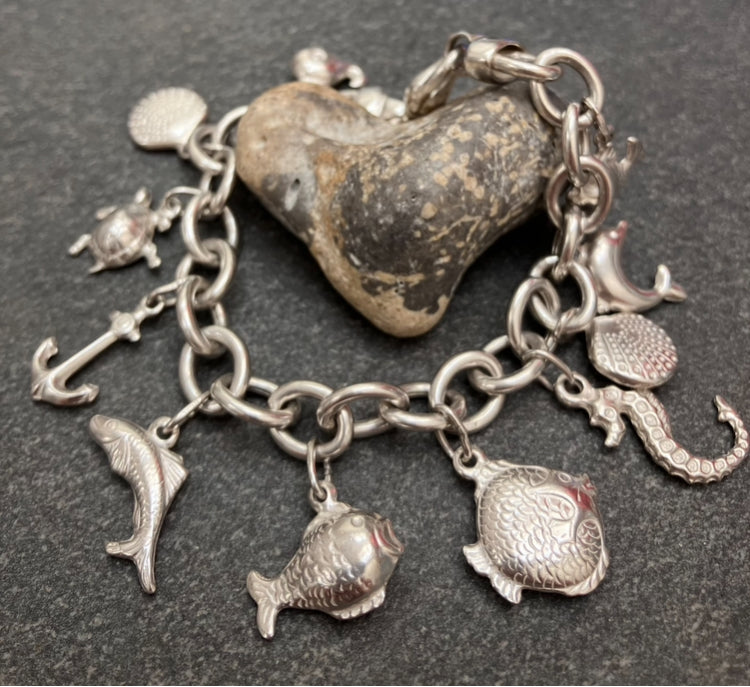 Absolutely stunning vintage sterling silver sea charm bracelet.