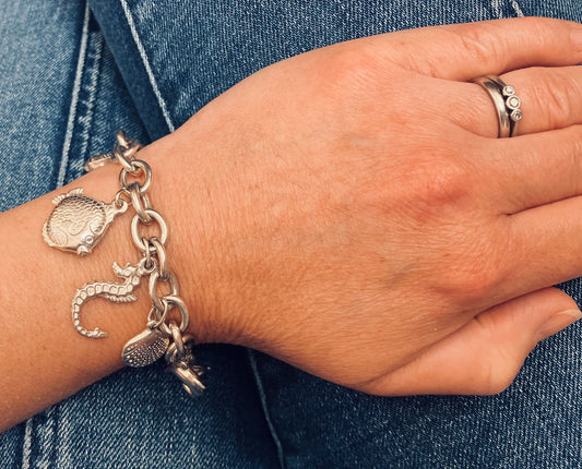 Absolutely stunning vintage sterling silver sea charm bracelet.