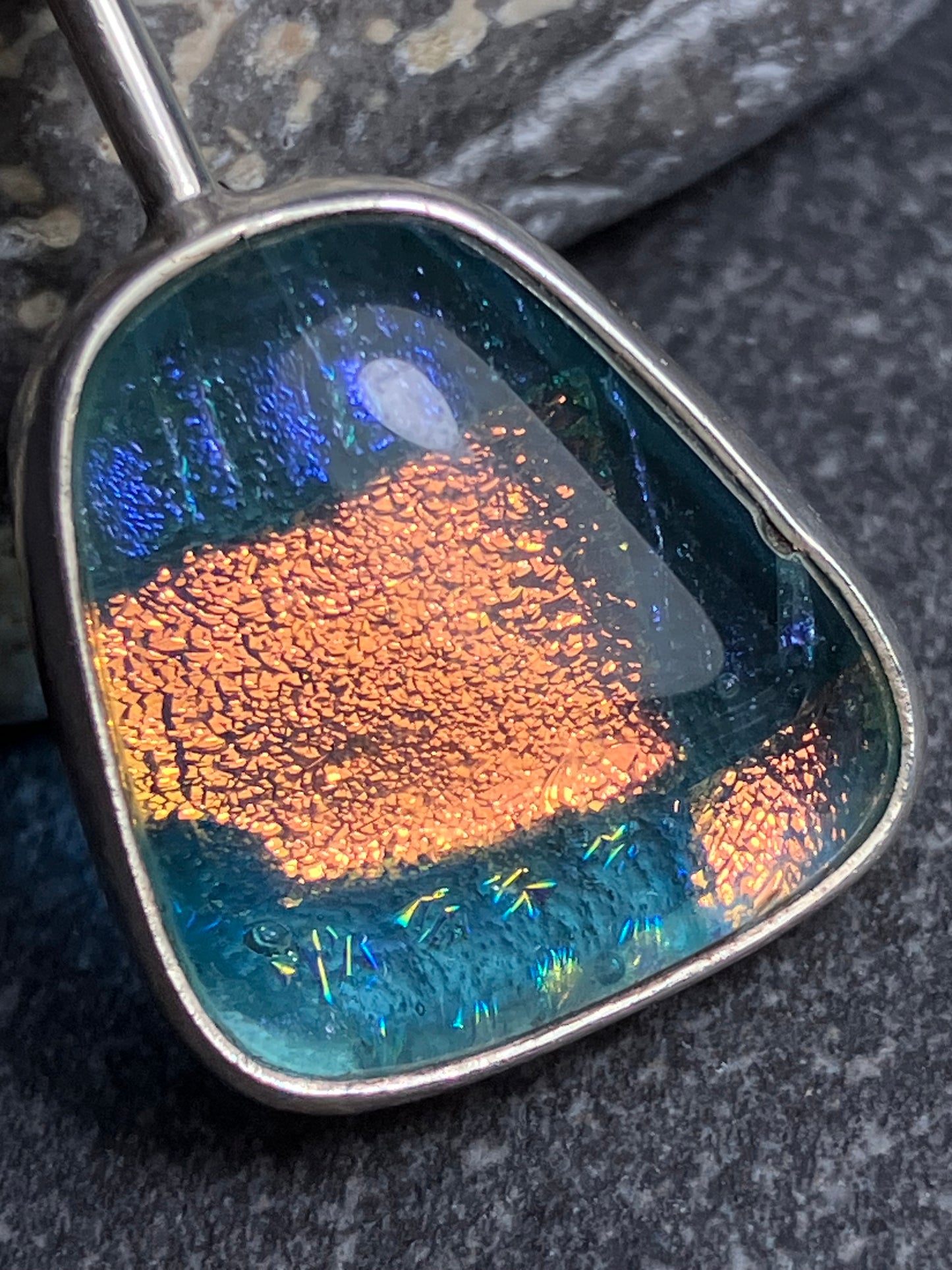 Absolutely wonderful luminous vintage dichrioc glass and sterling silver pendant.