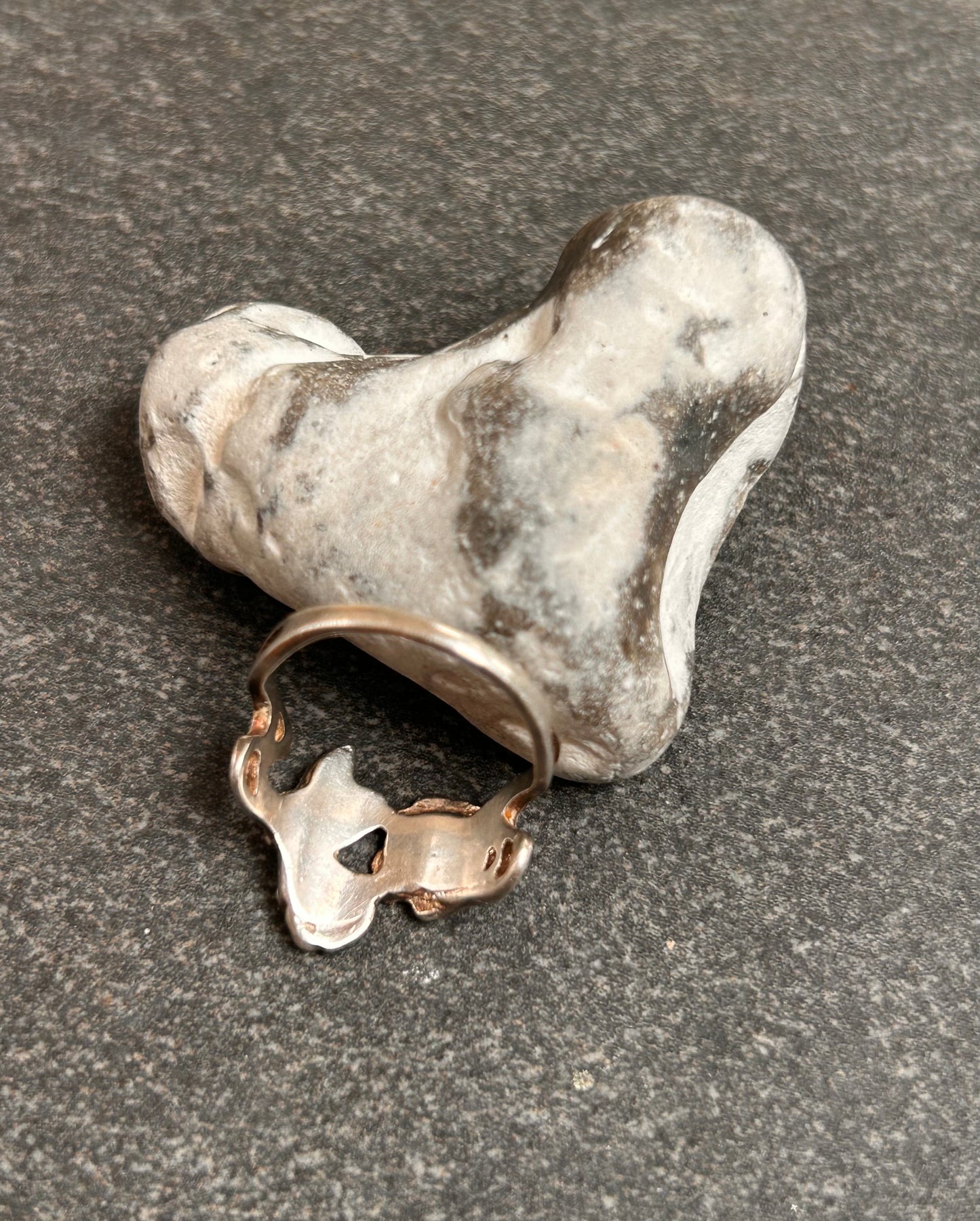 A beautiful and delicate vintage sterling silver ring by renowned silversmith and enamel artist Pat Cheney.