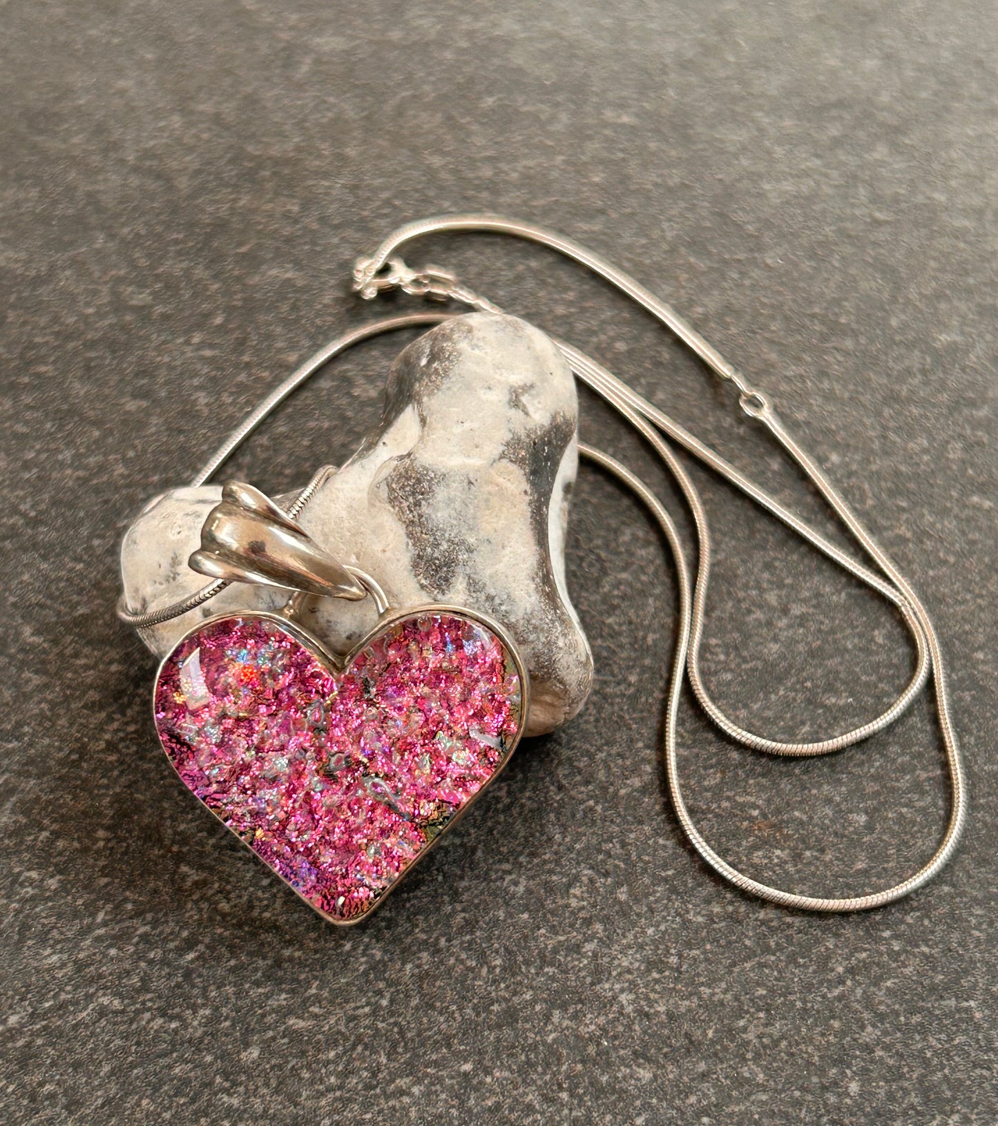 A beautiful vintage sterling silver and dichroic glass heart pendant