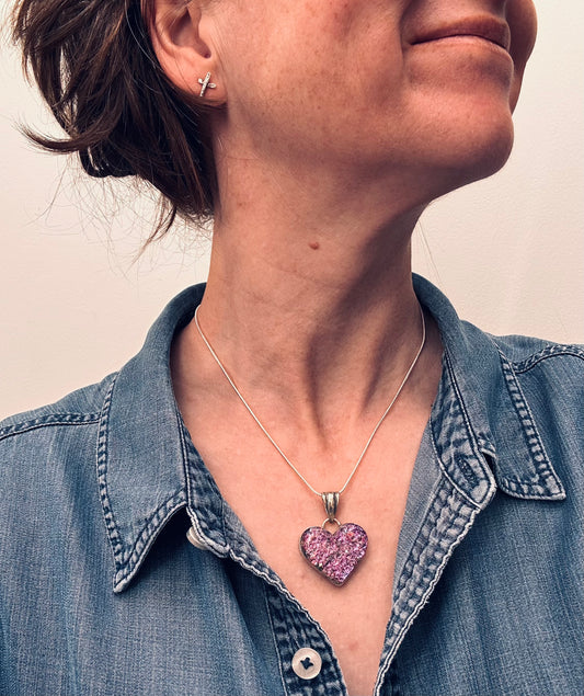 A beautiful vintage sterling silver and dichroic glass heart pendant