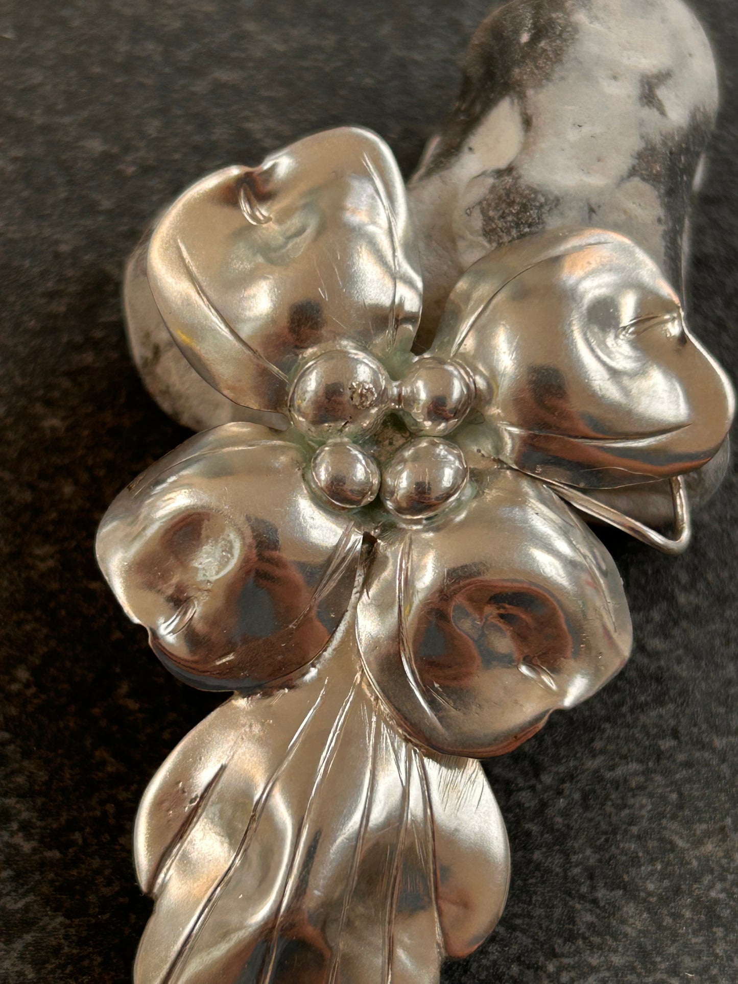 A rare sterling silver dogwood flower pendant from John Wanamaker.