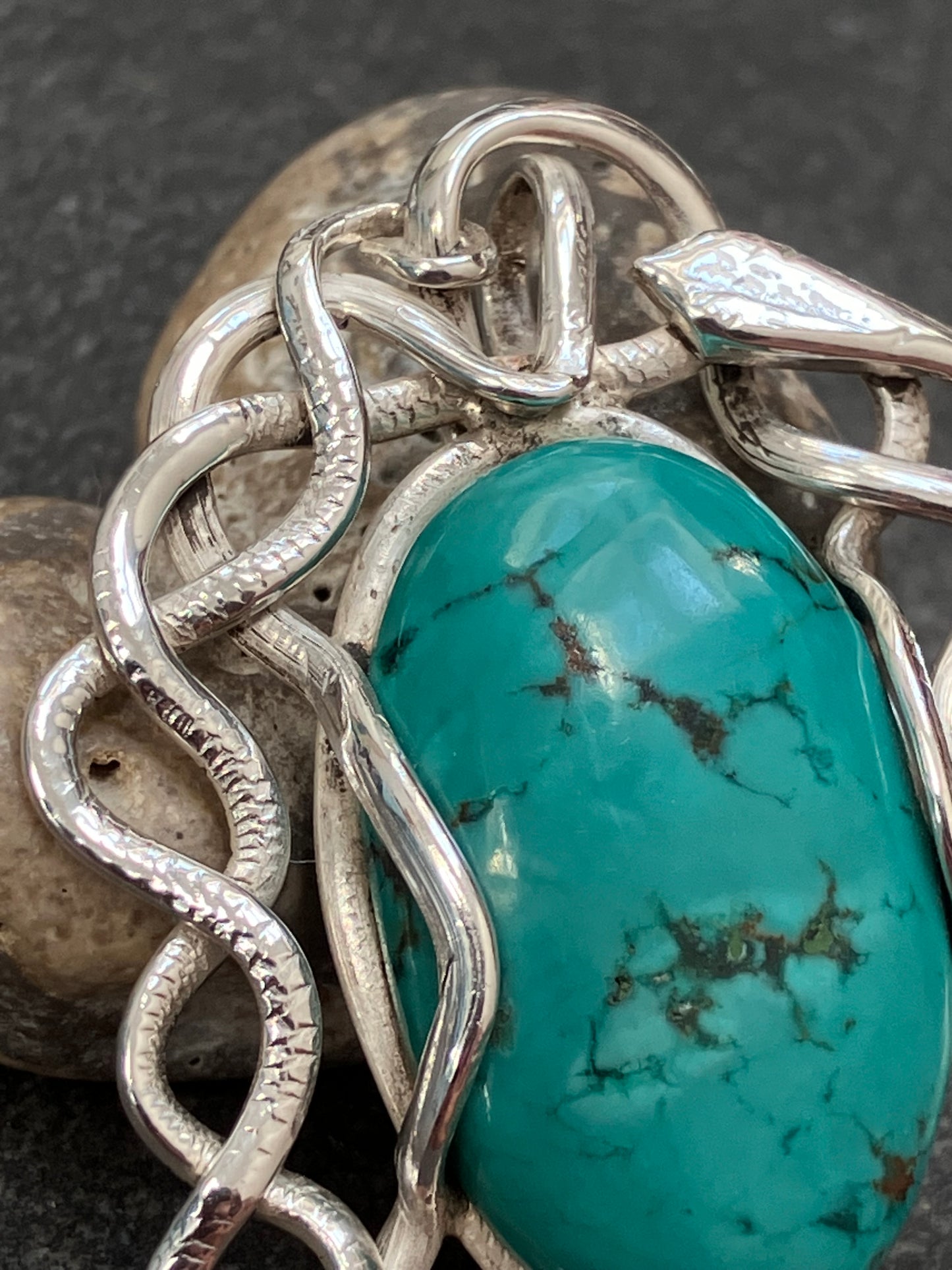 Artisan vintage sterling silver intertwining snake pendant with a piece of Turqurenite in the centre.