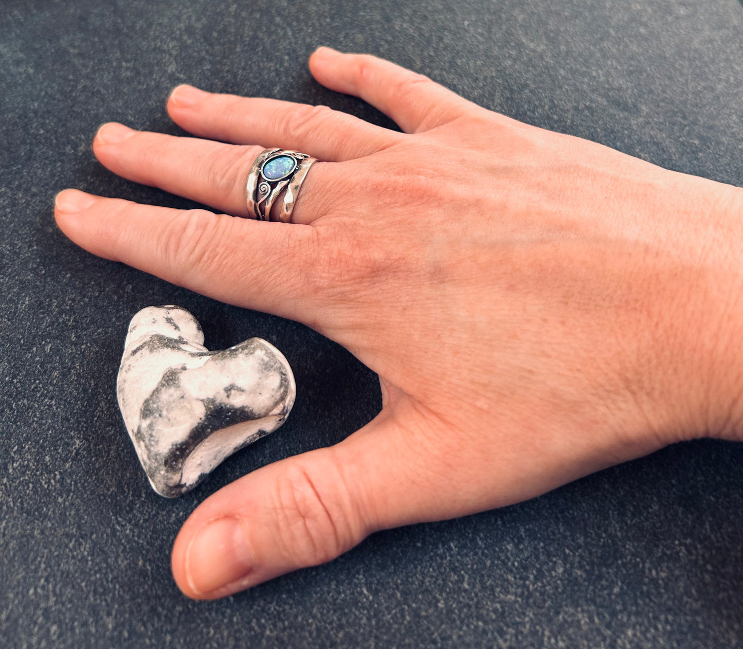 Vintage sterling silver artisan ring featuring a captivating lab-created opal