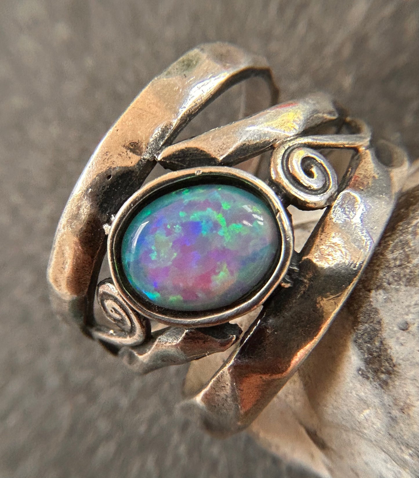 Vintage sterling silver artisan ring featuring a captivating lab-created opal