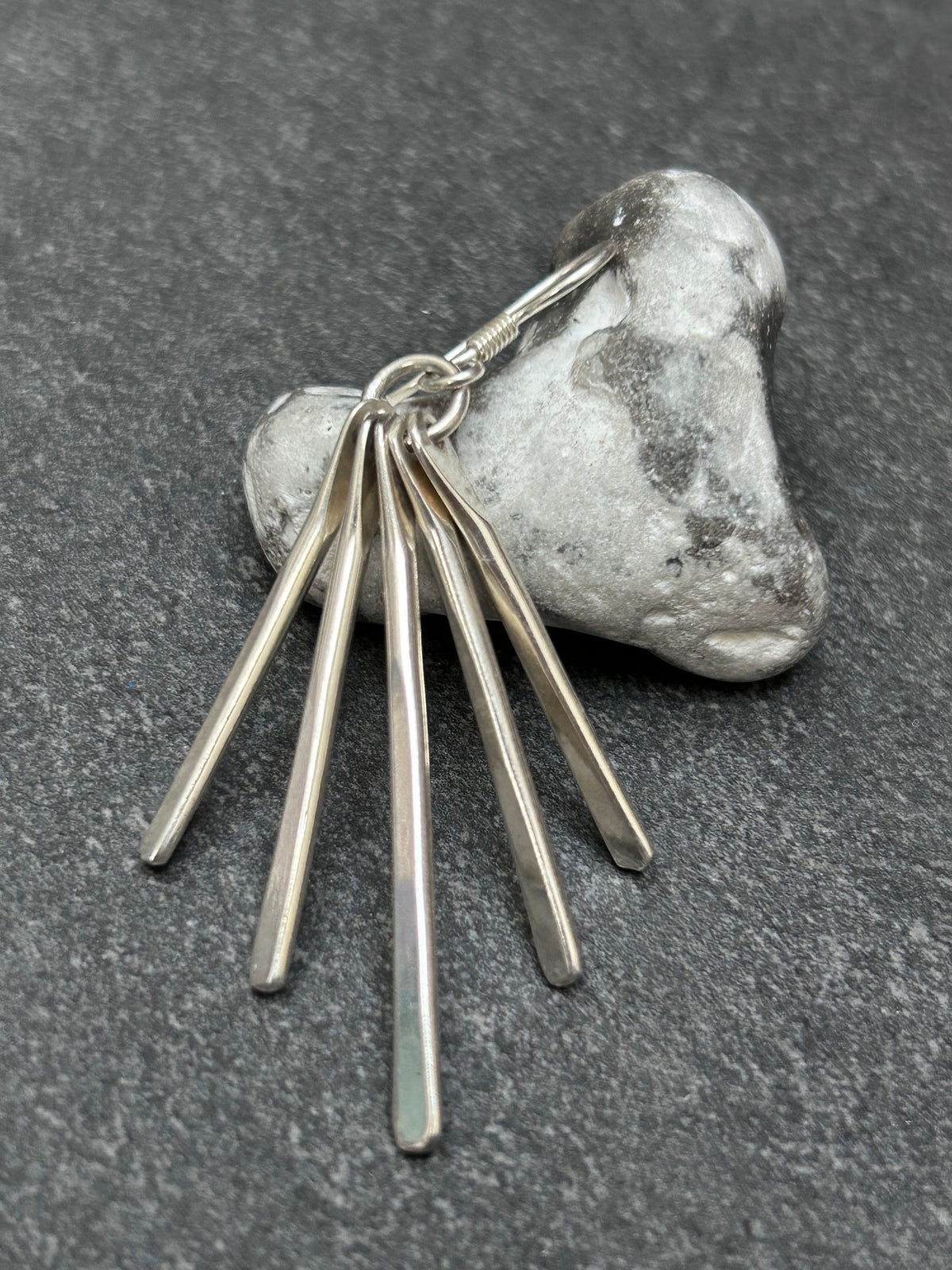 Mexican sterling silver earrings featuring slender bars.