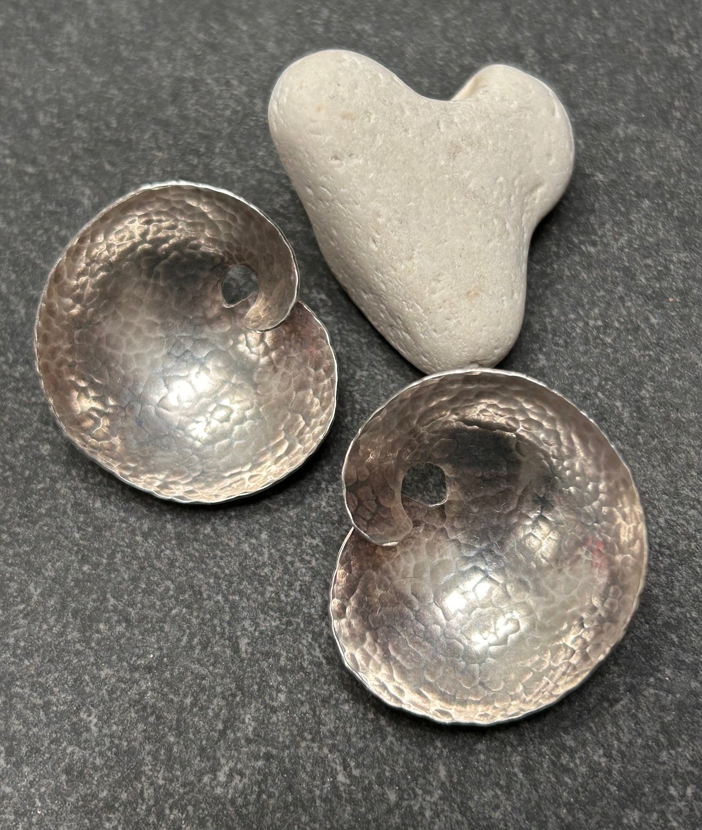 A striking pair of artisan-made vintage sterling silver earrings