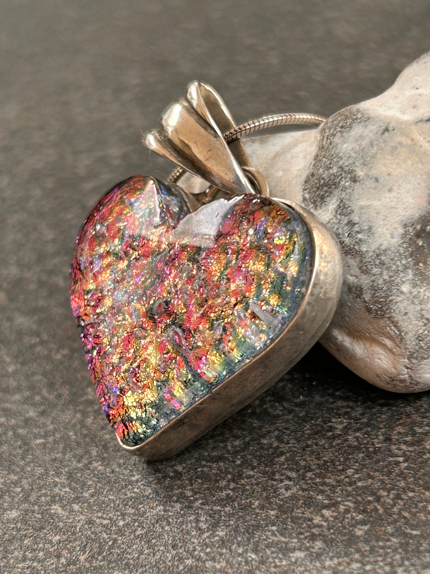 A beautiful vintage sterling silver and dichroic glass heart pendant